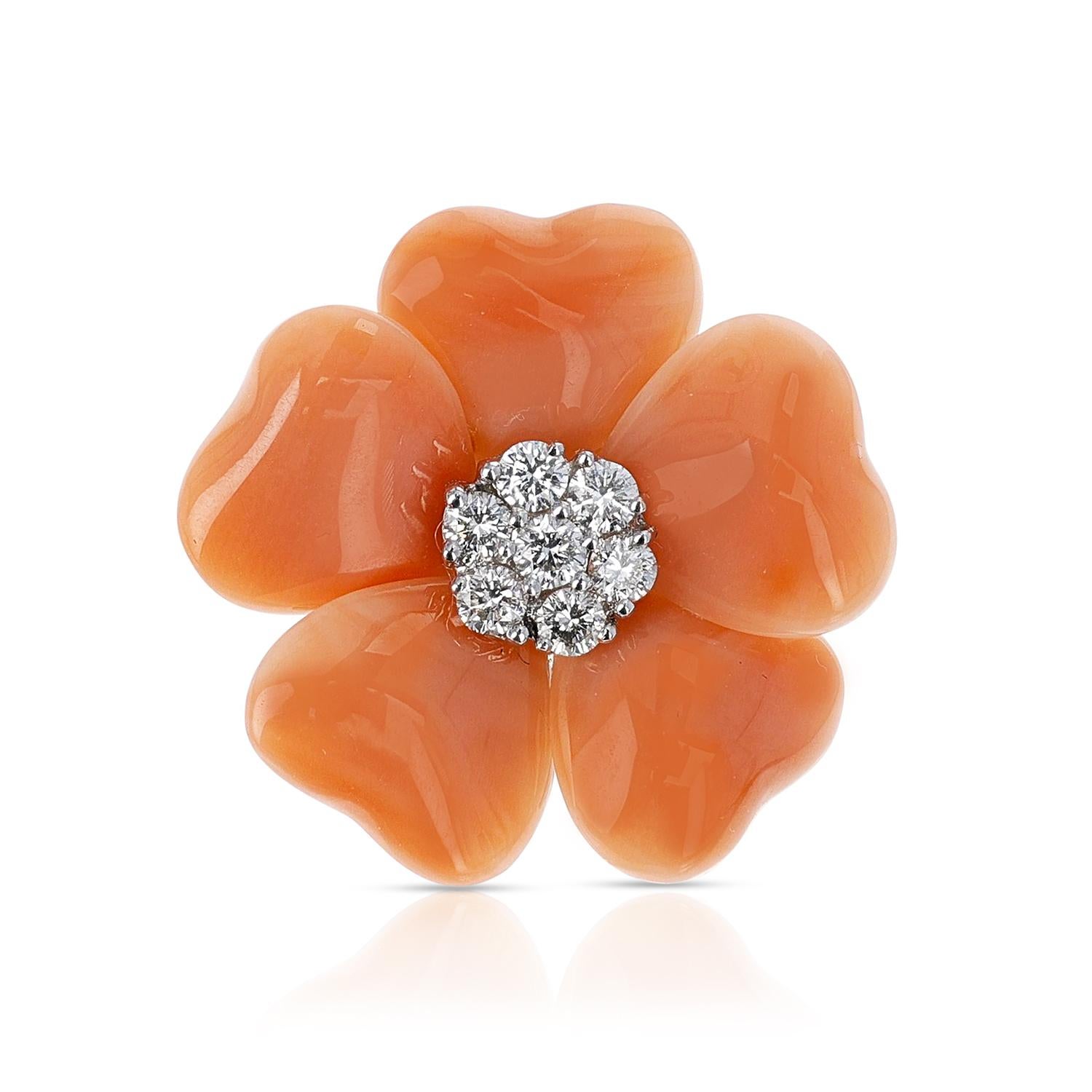 A Floral Coral Ring with seven round diamonds, weighing 0.27 cts. total made in 18 Karat White Gold. Total Weight 8.48 grams. Ring Size US 7.