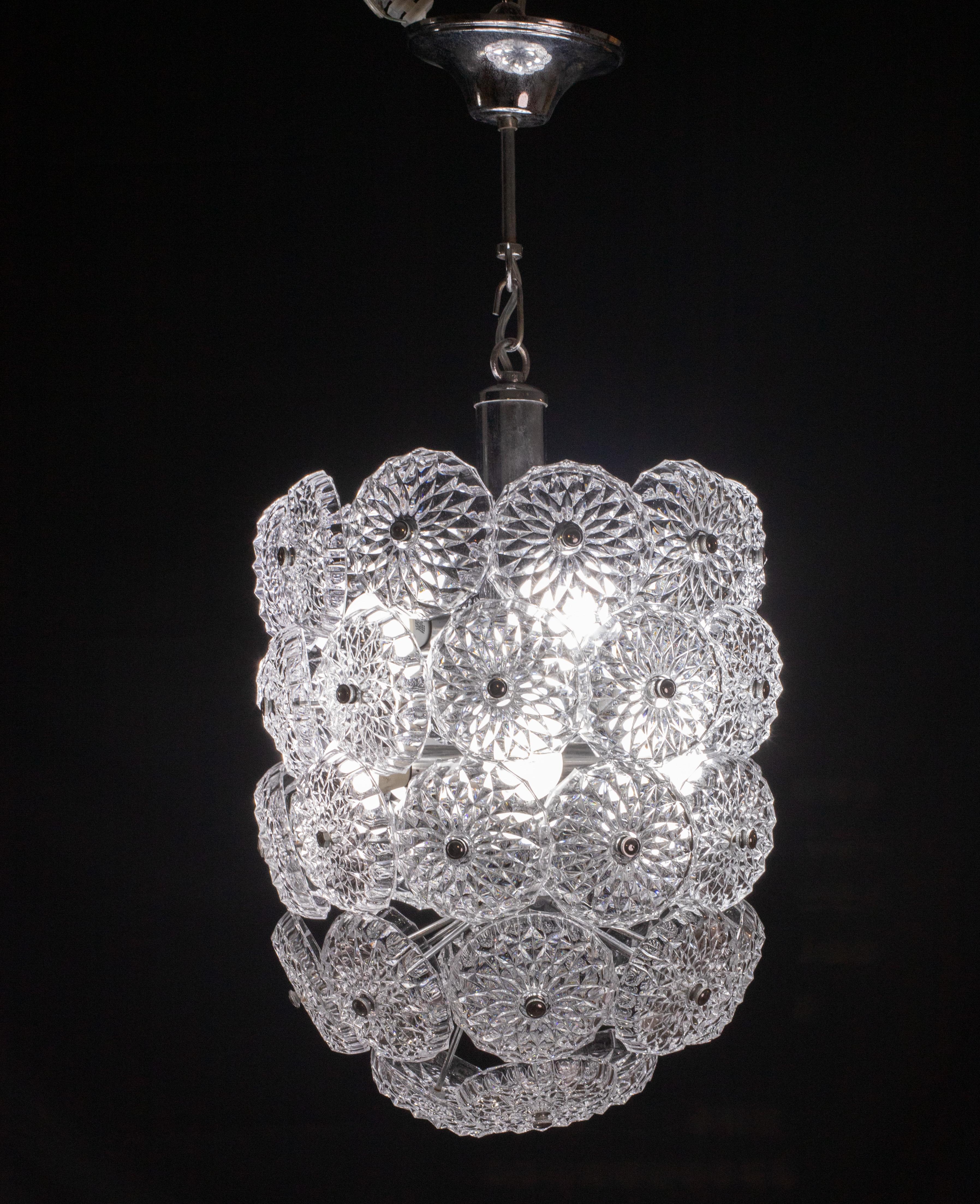 Spunik style crystal chandelier.

Period: circa 1970

The chandelier has 10 light points, very good vintage condition, a small bolt that mounts on the flower has been replaced