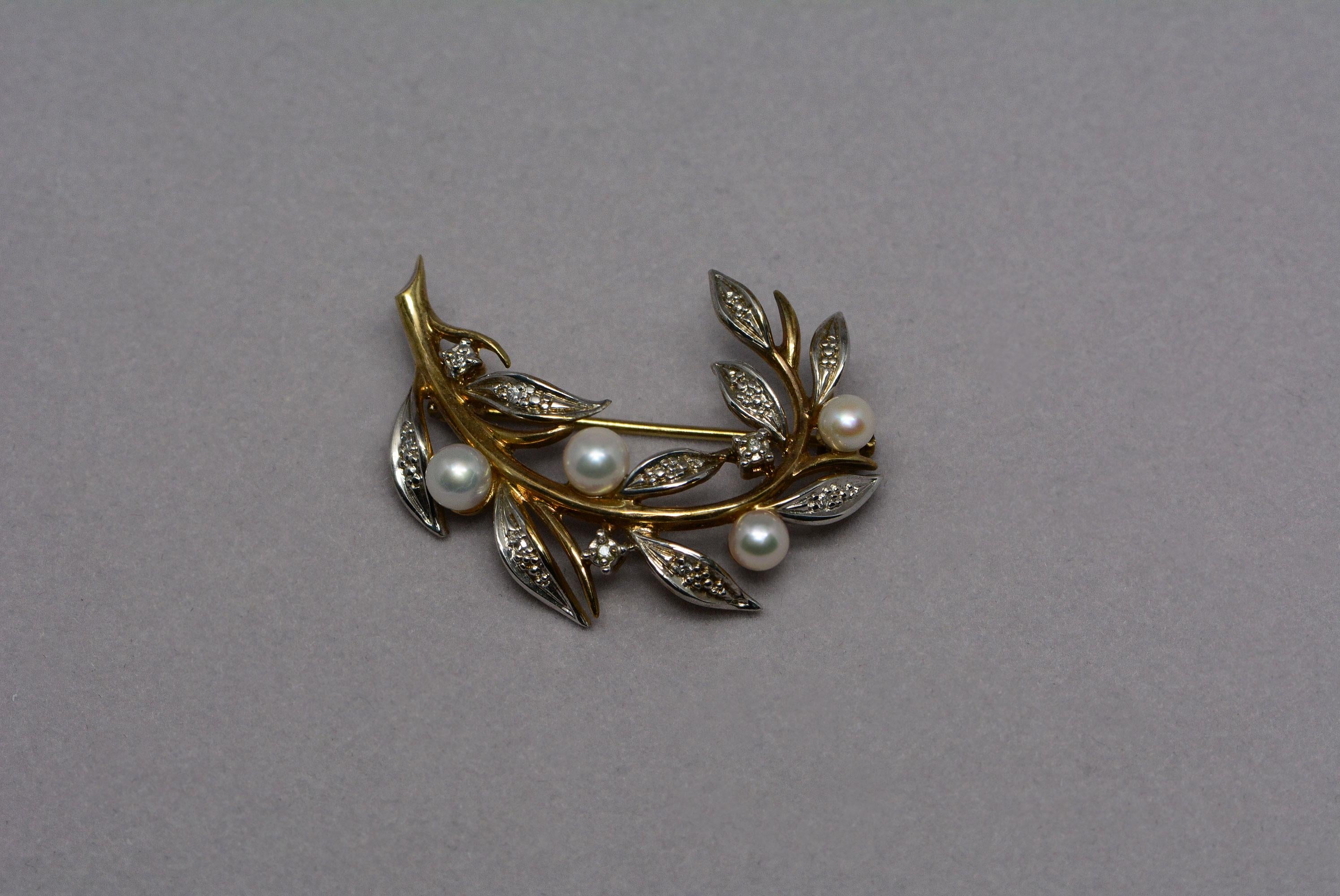 ﻿This vintage pearl brooch and earring set is made from white and yellow 9 karat gold, it has six cultured pearls and fourteen single cut diamonds set into it.

The brooch has four round cultured pearls and eight single cut diamonds which weigh: