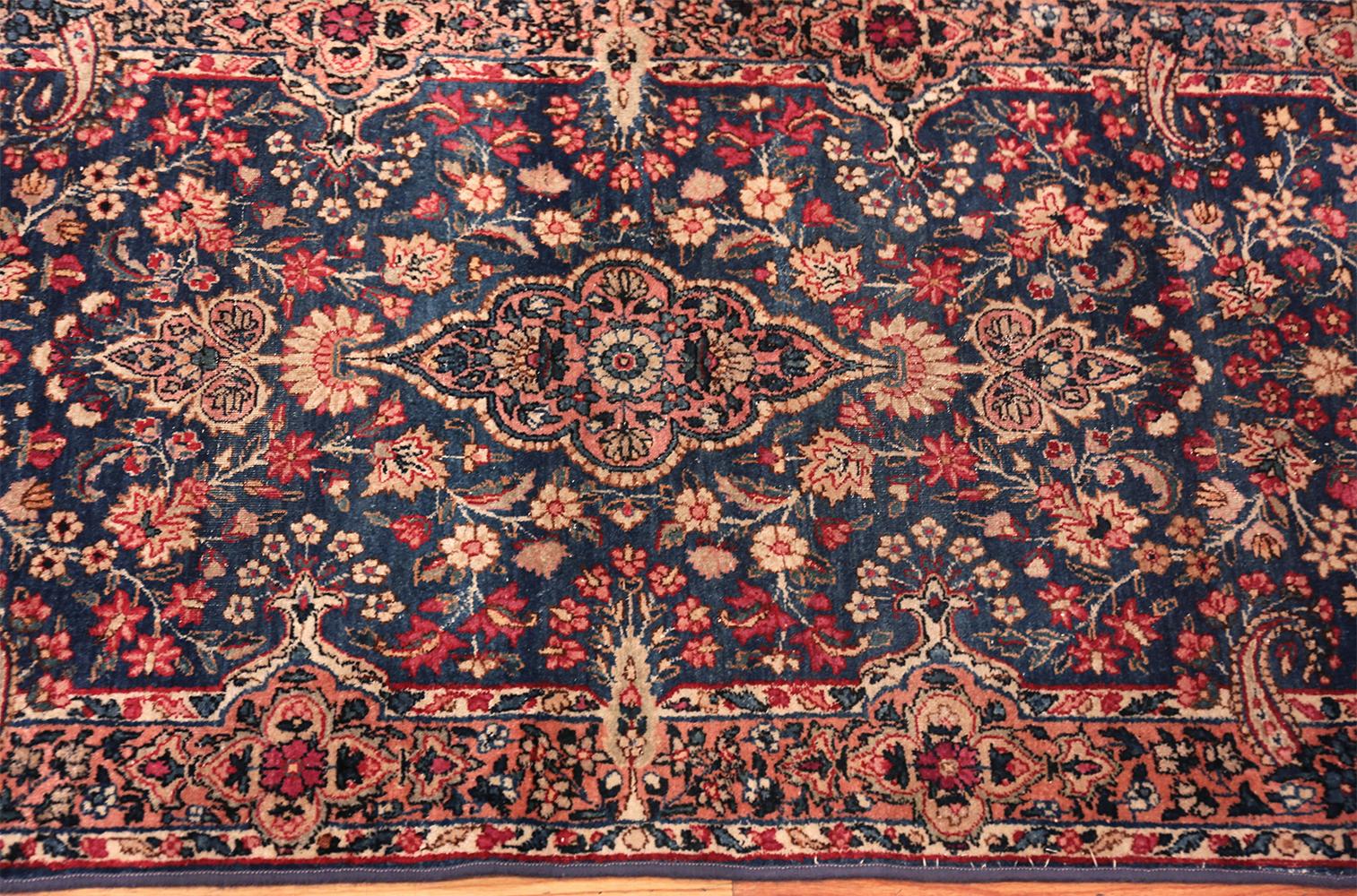 A stunning floral design antique Persian Kerman runner rug, country of origin: Persia, date: circa 1920 - Size: 2 ft 6 in x 25 ft 6 in (0.76 m x 7.77 m). This breathtaking rug from Kerman is an exceptionally rare find for several reasons. Kerman has