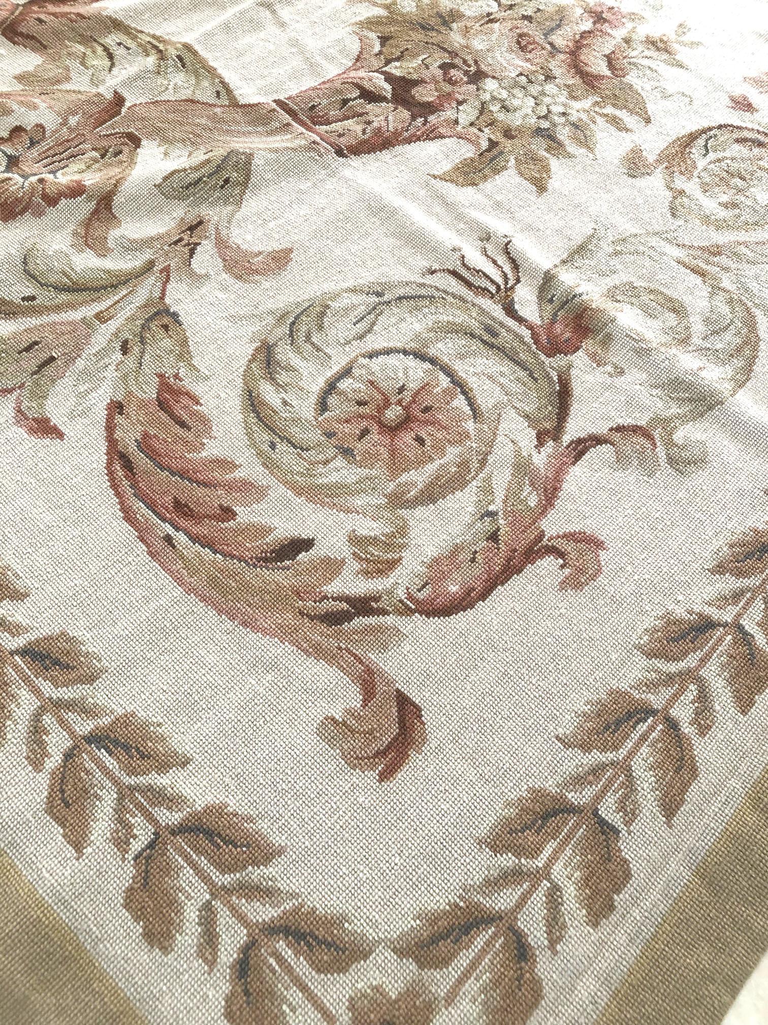 Handwoven French design flat-weave, with wool pile and wool foundation. This piece features a floral bouquets, medallion and more tapestry-like designs. This piece is from new which the pastel colors with historical French style will boost your room