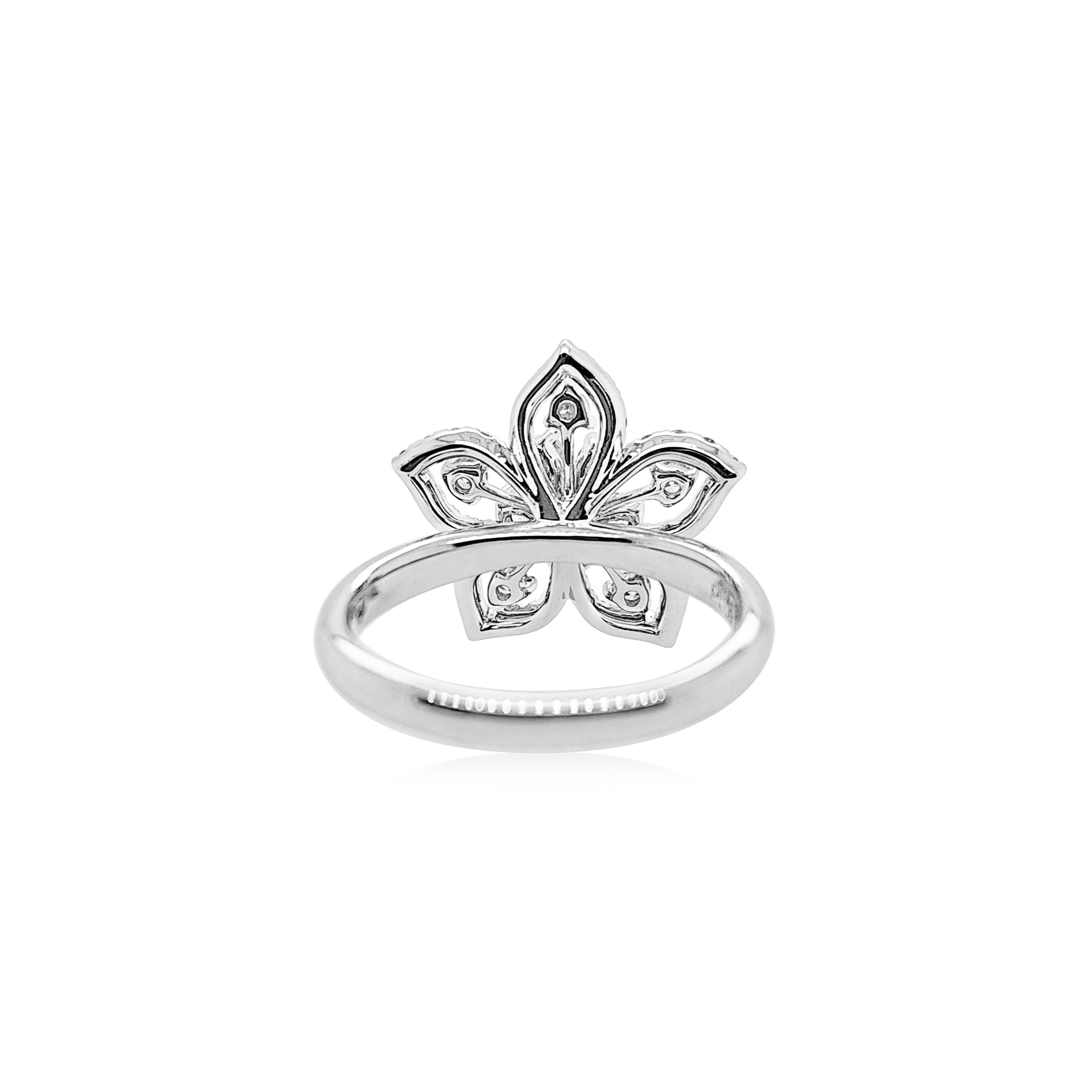 Beautifully designed floral style ring with Pear shape and Round shape brilliant cut natural white diamonds. A perfect piece to wear to an evening party and sparkle your way in.

Pear and Round Shape White diamonds: 0.37 cts
Round Brilliant cut