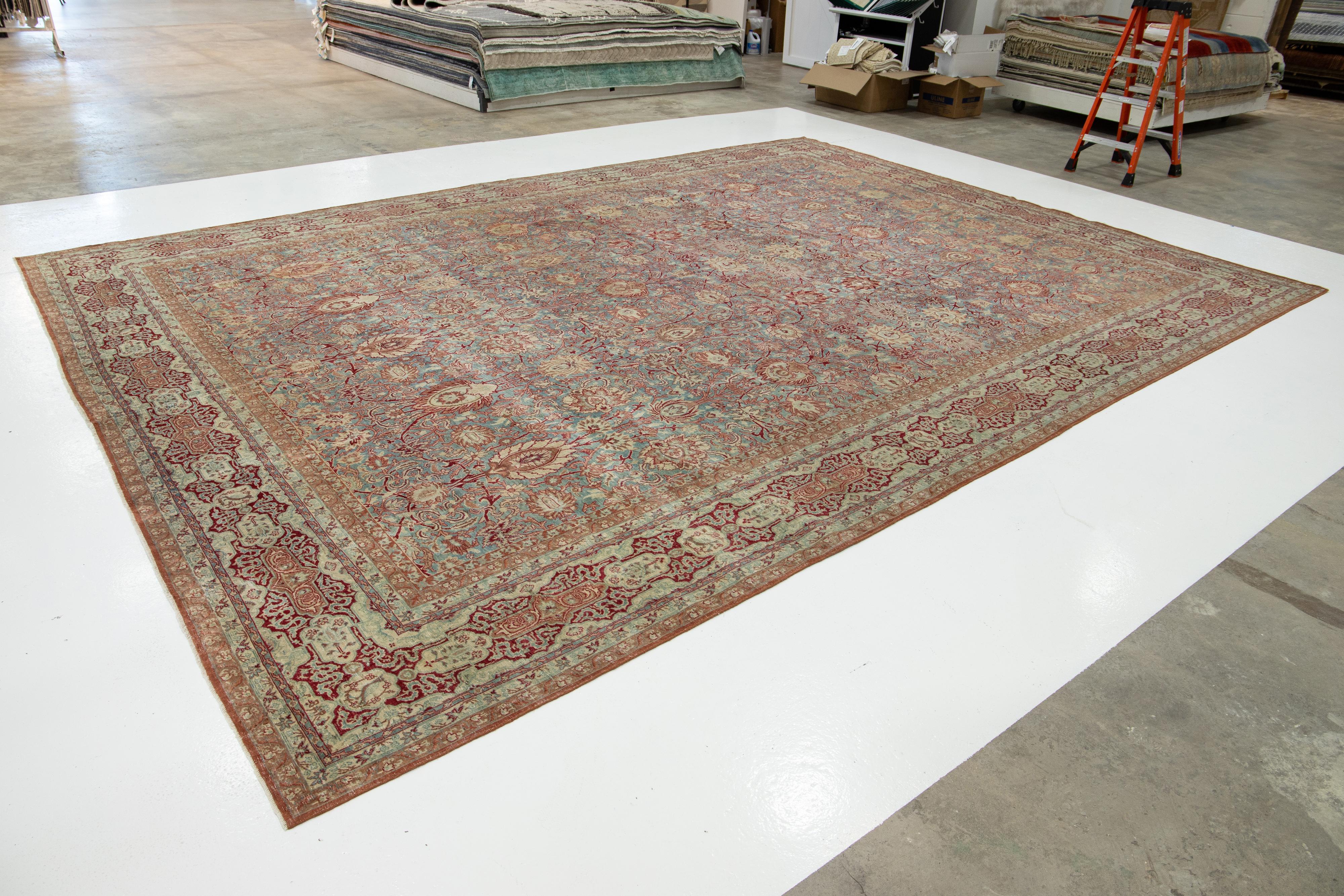 Hand-Knotted Floral Designed Antique Persian Malayer Wool Rug In Blue From The 1890s For Sale