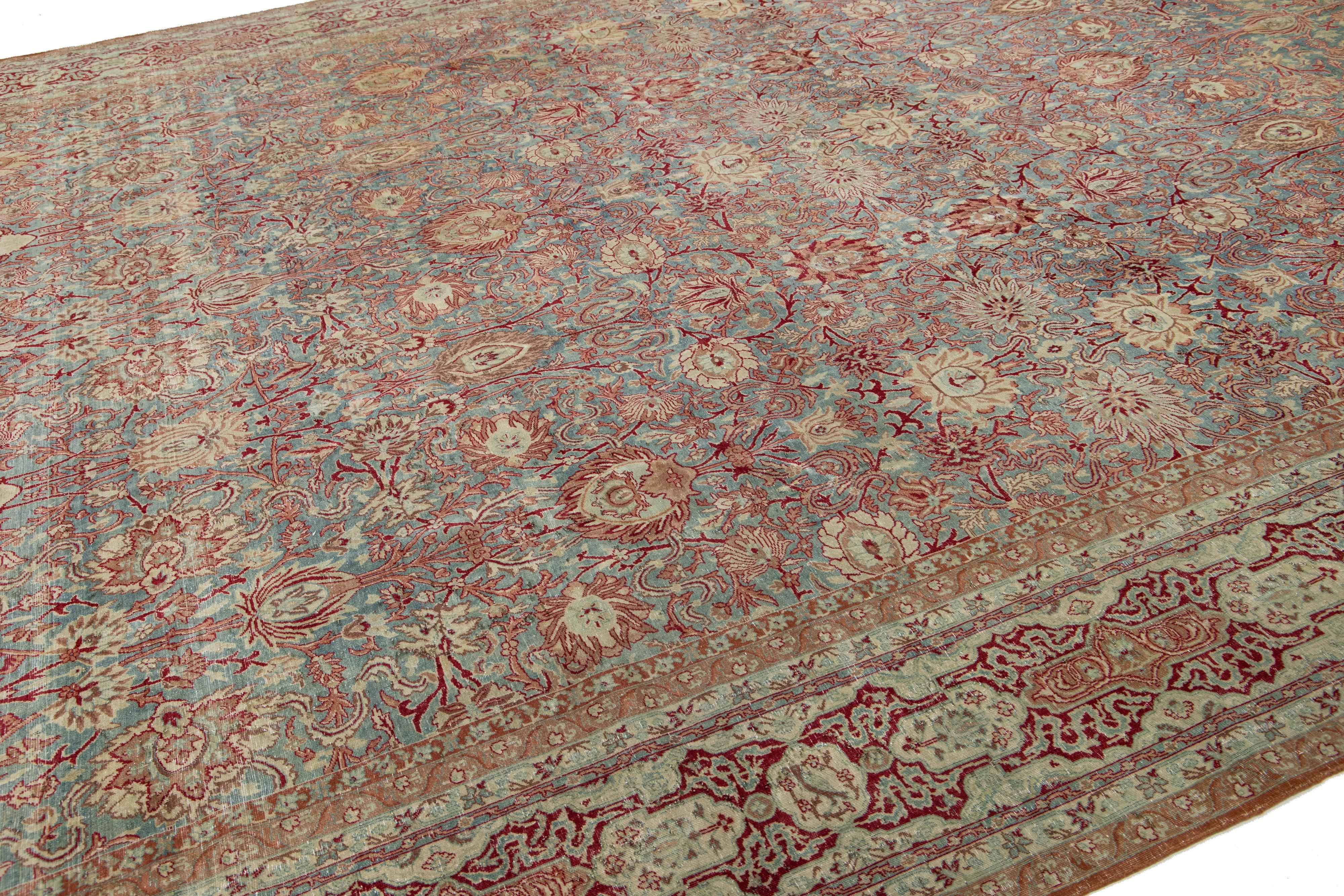 19th Century Floral Designed Antique Persian Malayer Wool Rug In Blue From The 1890s For Sale