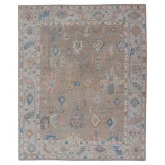 Floral Designed Modern Oushak on a Tan Field and Shades of Blue in the Motifs