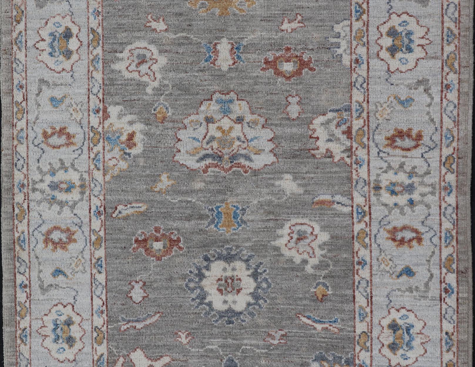 Afghan Floral Designed Oushak with Muted Background with Earthy Tones and Soft Blue For Sale