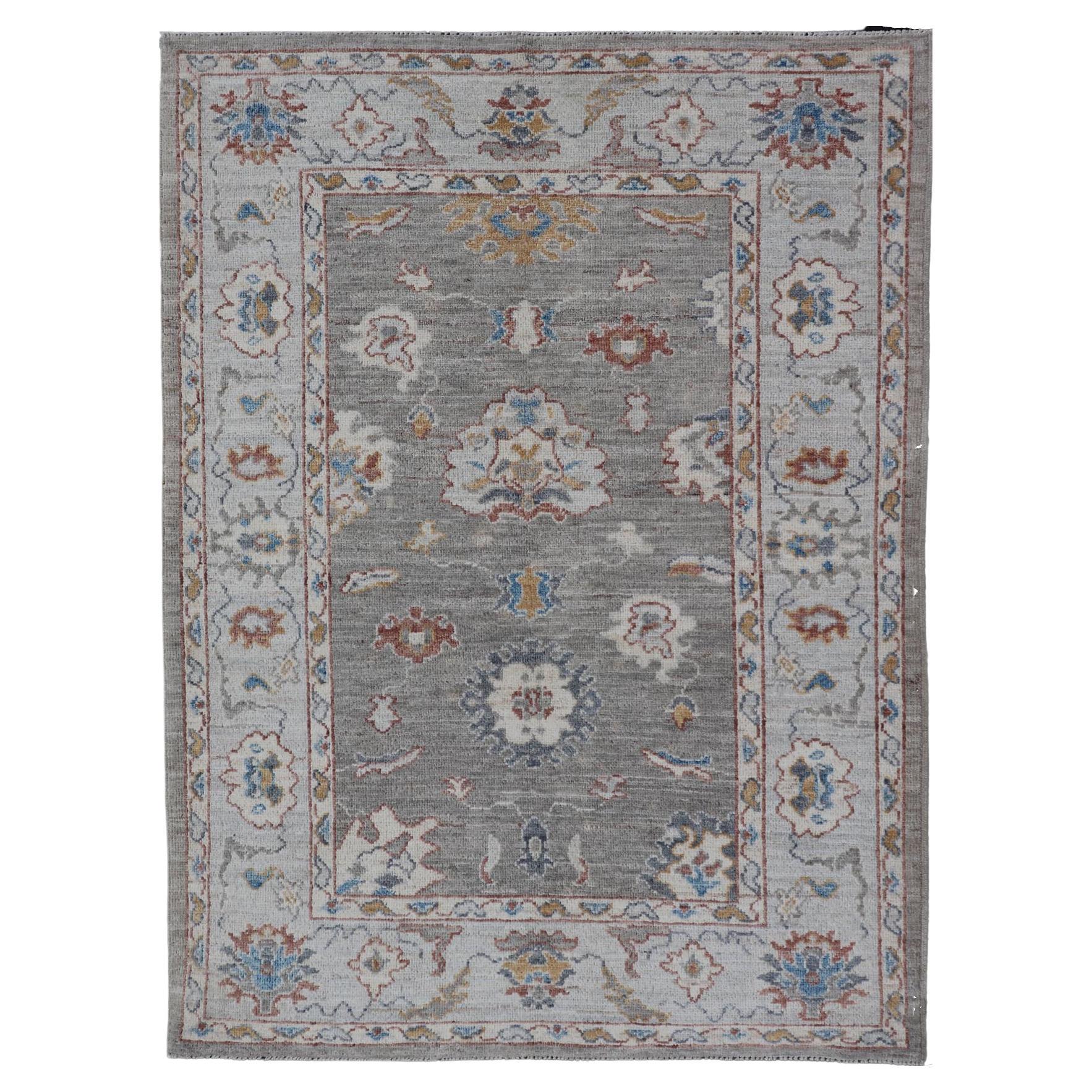 Floral Designed Oushak with Muted Background with Earthy Tones and Soft Blue