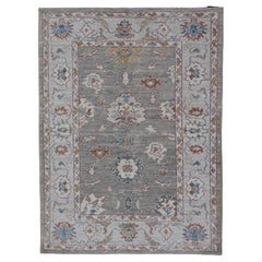 Floral Designed Oushak with Muted Background with Earthy Tones and Soft Blue