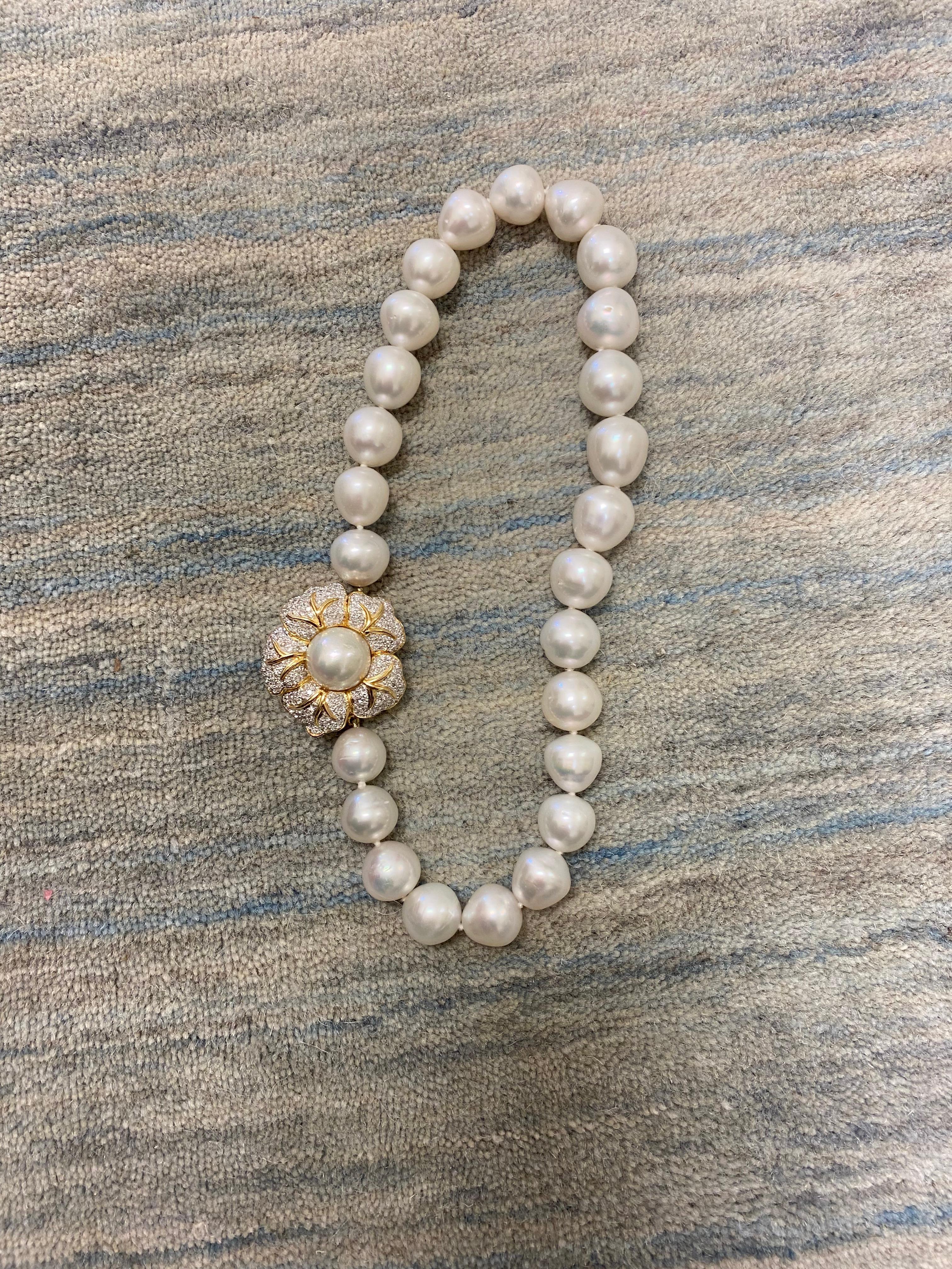 Gorgeous 14kt Yellow gold Floral Clasp/Enhancer.  This stunning clasp priced with The South Sea Pearl necklace shown here.  The clasp is made to interchange with the other clasp.  There is a second clasp also shown, that can be purchased