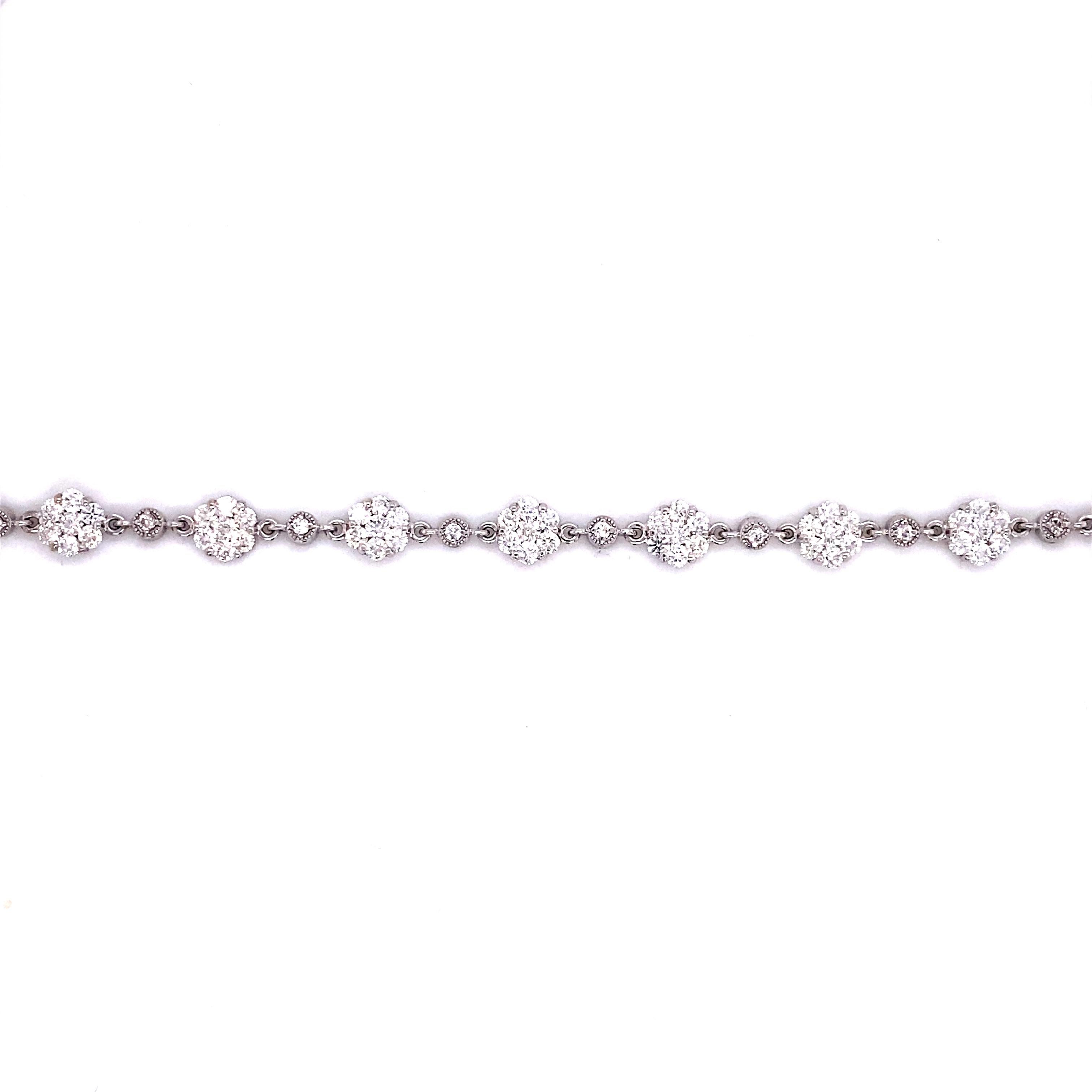 Floral Diamond Link Bracelet 

A sweet and delicate diamond flower link bracelet perfect for layering on the wrist. Abundance of diamonds,   weighing over 3 carats of natural round brilliant diamonds.  Crafted in 18 karat white gold. 

Details: 
18