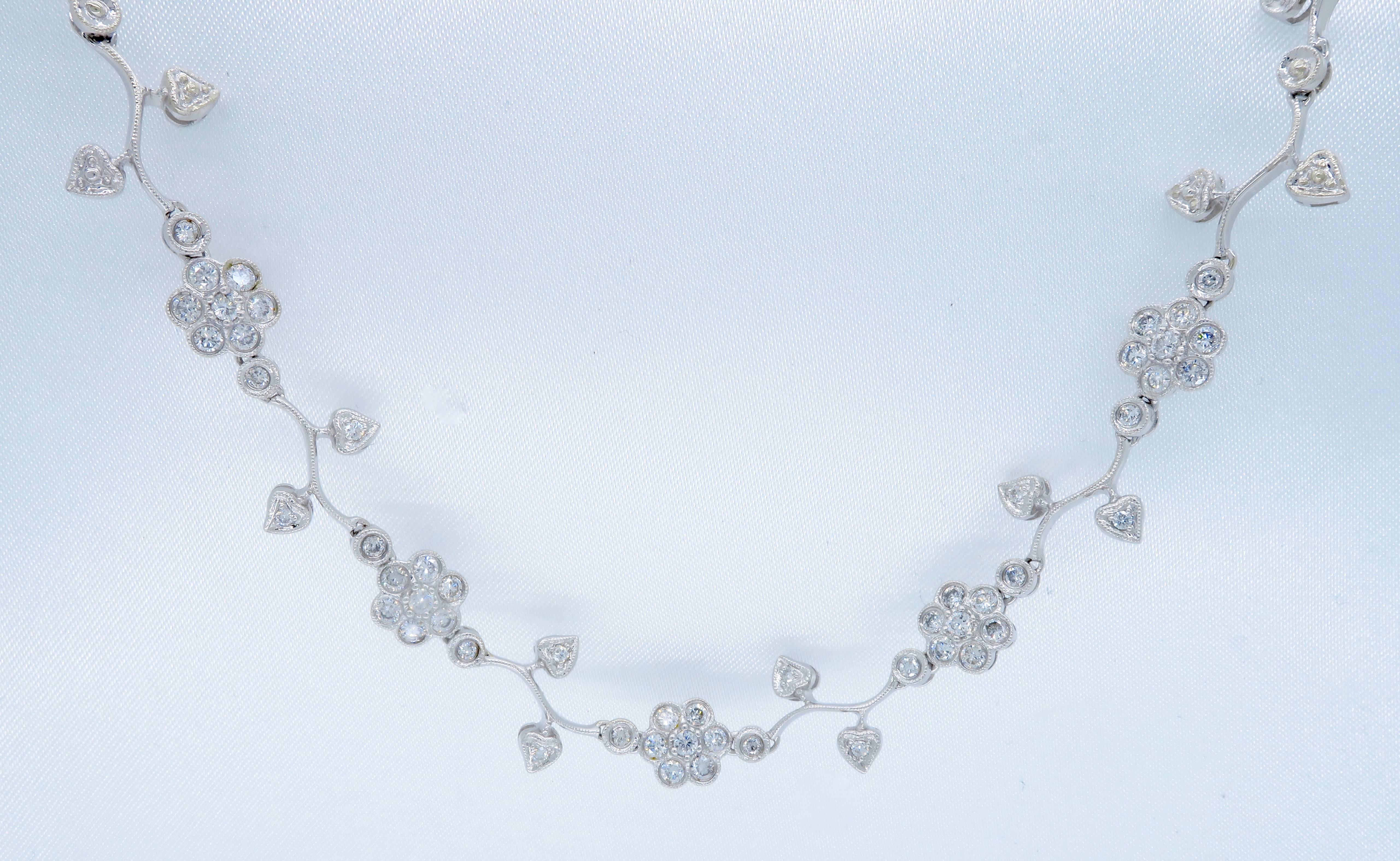 This necklace features 53 Round Brilliant Cut Diamonds displayed in an elegant floral pattern. There is approximately 1.35CTW of diamonds in this necklace. The diamonds display an average color of G-I and average clarity of SI1-I1. The 14k white
