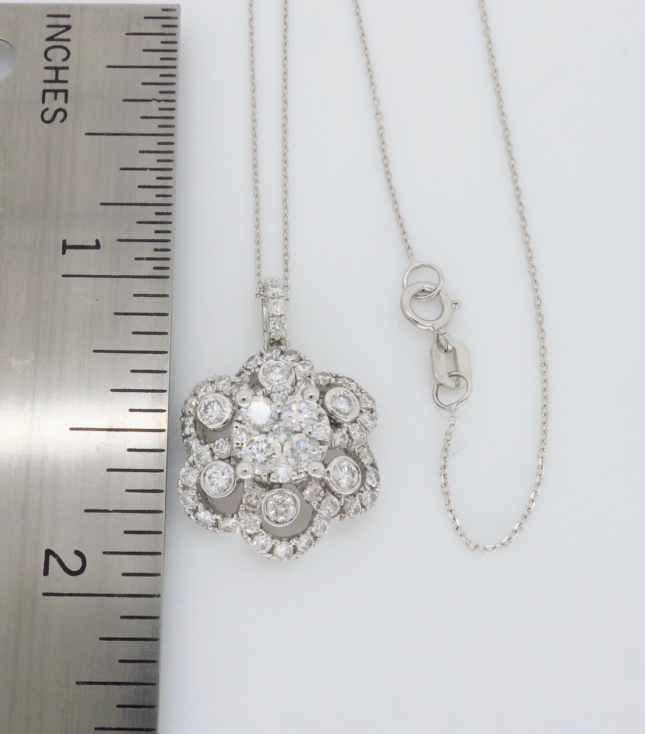 Floral designed diamond pendant necklace crafted in 14k white gold. 

Diamond Carat Weight: Approximately 1.48CTW
Diamond Cut: Round Brilliant Cut
Color: Average G-H
Clarity: Average VS-I
Metal: 14K White Gold
Pendant Length: Approximately 13/16”