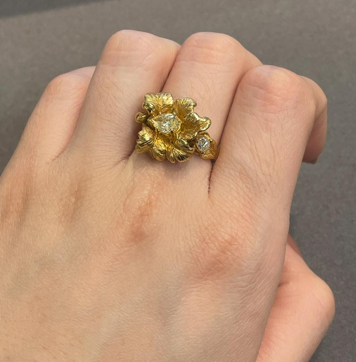Floral Diamond Ring 

A sculptural yellow gold flower ring set with two pear shape diamonds

Approximate Diamond Weight: .95 carats
Ring Size: 6.5
Complimentary resizing 
Approximate Weight: 8.6 grams
Metal Type:  14 karat gold

