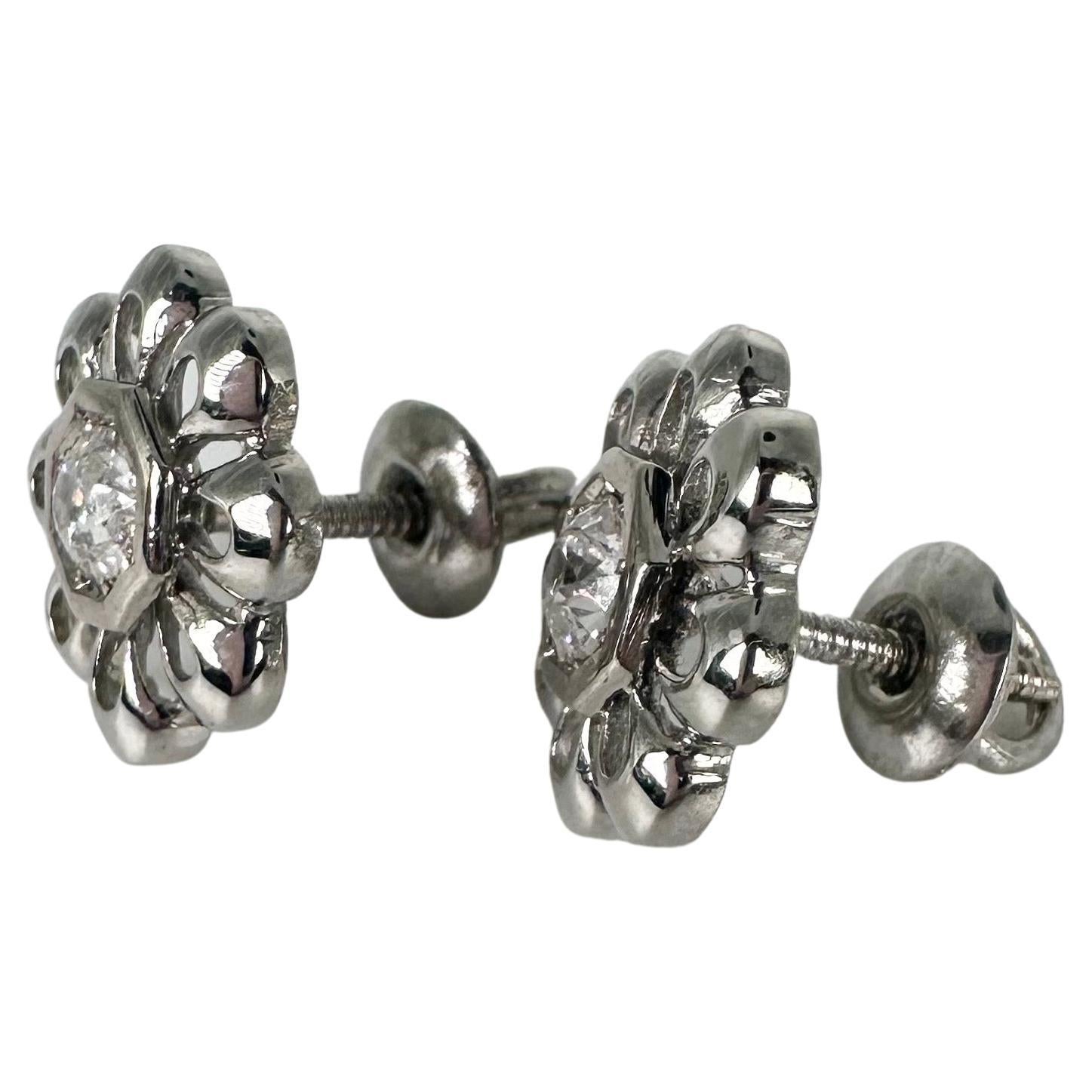 Floral stud earrings made with beautiful diamonds in a screw back setting for extra security, the earrings are made in 14KT white gold and look fabulous on any ears!

GOLD: 14KT gold
NATURAL DIAMOND(S)
Clarity/Color: SI/H
Carat:0.36ct
Cut:Round (old