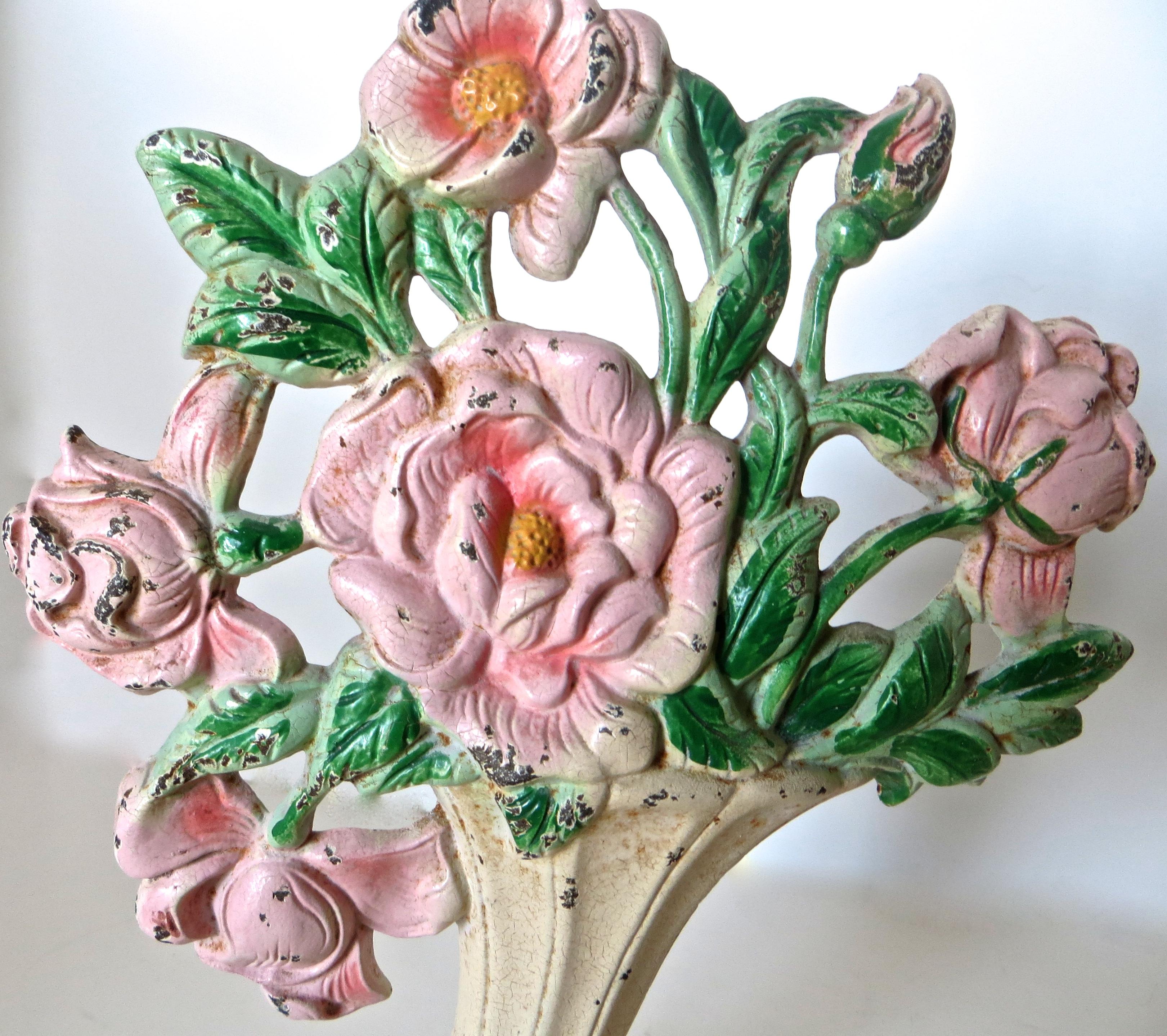 Cast iron hand-painted floral doorstop made by the Hubley Manufacturing Company, Lancaster, Pennsylvania, circa 1930s. 
Embossed and numbered 