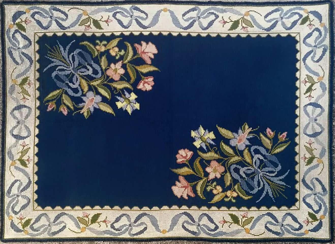 Beautiful Portuguese rug from Arraiolos, with a decorative design and light colors in cream and blue entirely hand embroidered with Portuguese needlepoint method, with wool on jute foundation. The work of one embroiderer is required for a full year,