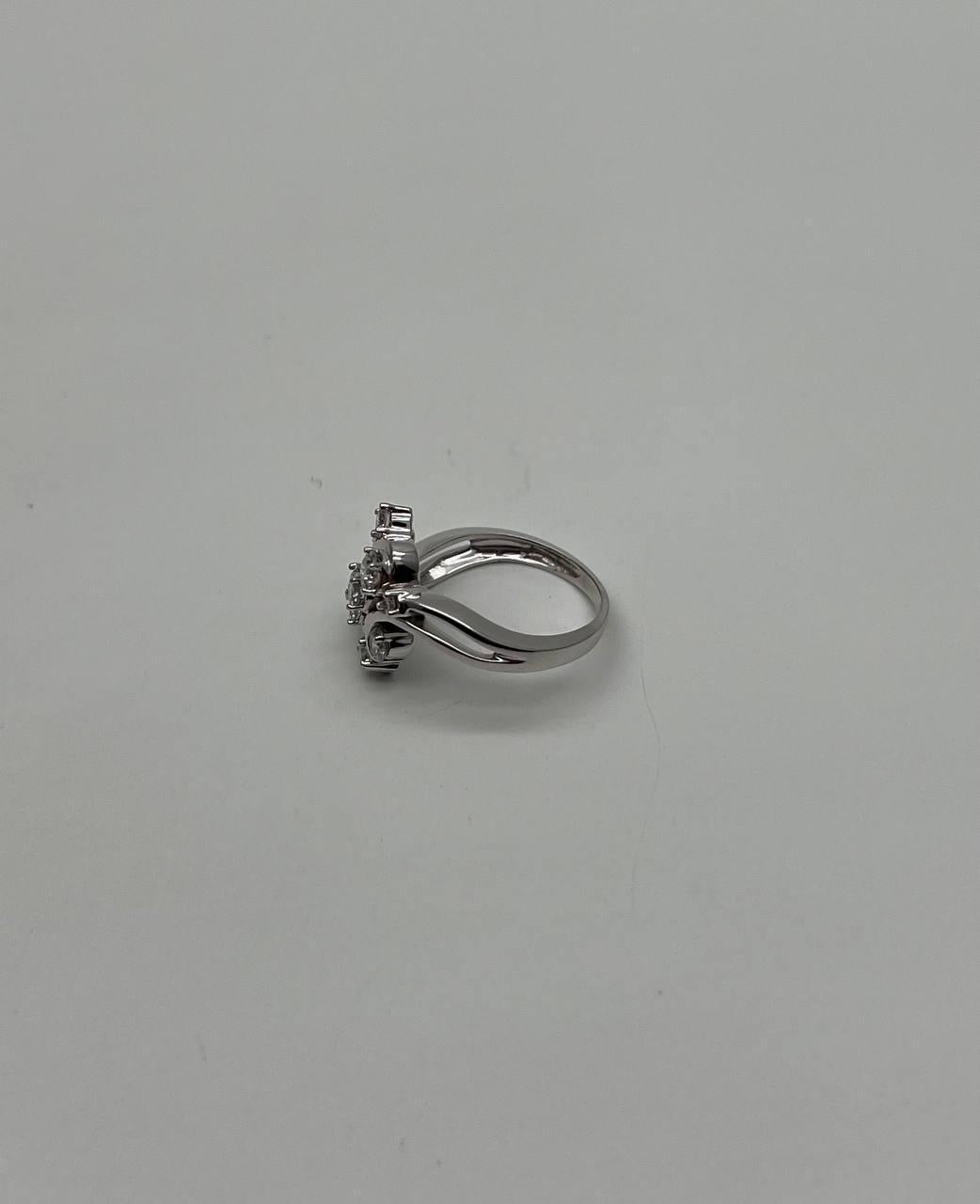 Elegant and Contemporary.
Set with Round Brilliant-Cut Diamonds.
Accented by Intertwined Bands of White Gold.
Floral Flower Bouquet 
14K White Gold 
0.80 CTW Diamonds