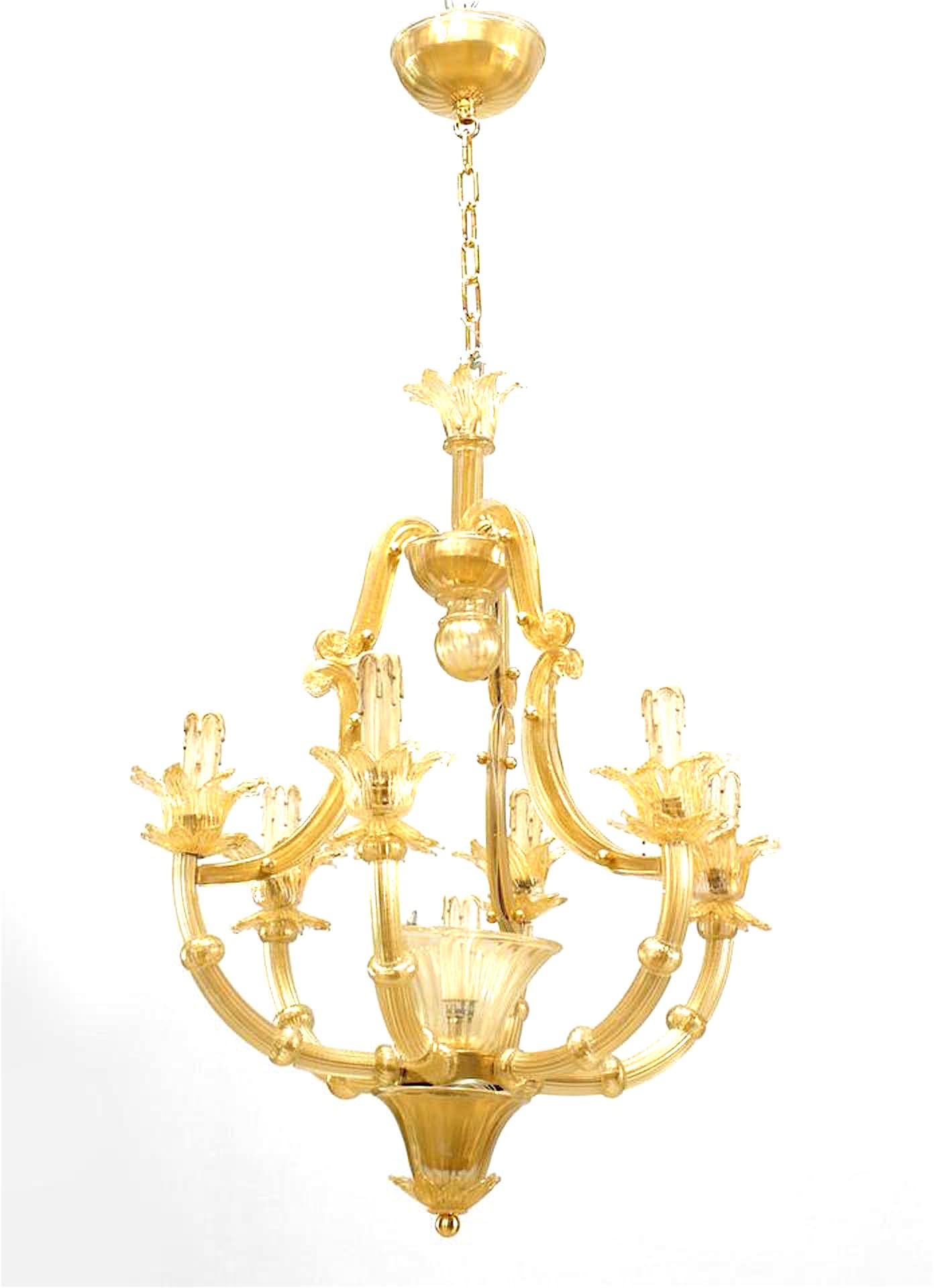Italian Venetian Murano hand blown gold dusted 6 fluted arm chandeliers with flower bobeche & cup and three scroll arm supports rising from a 7th central light.
