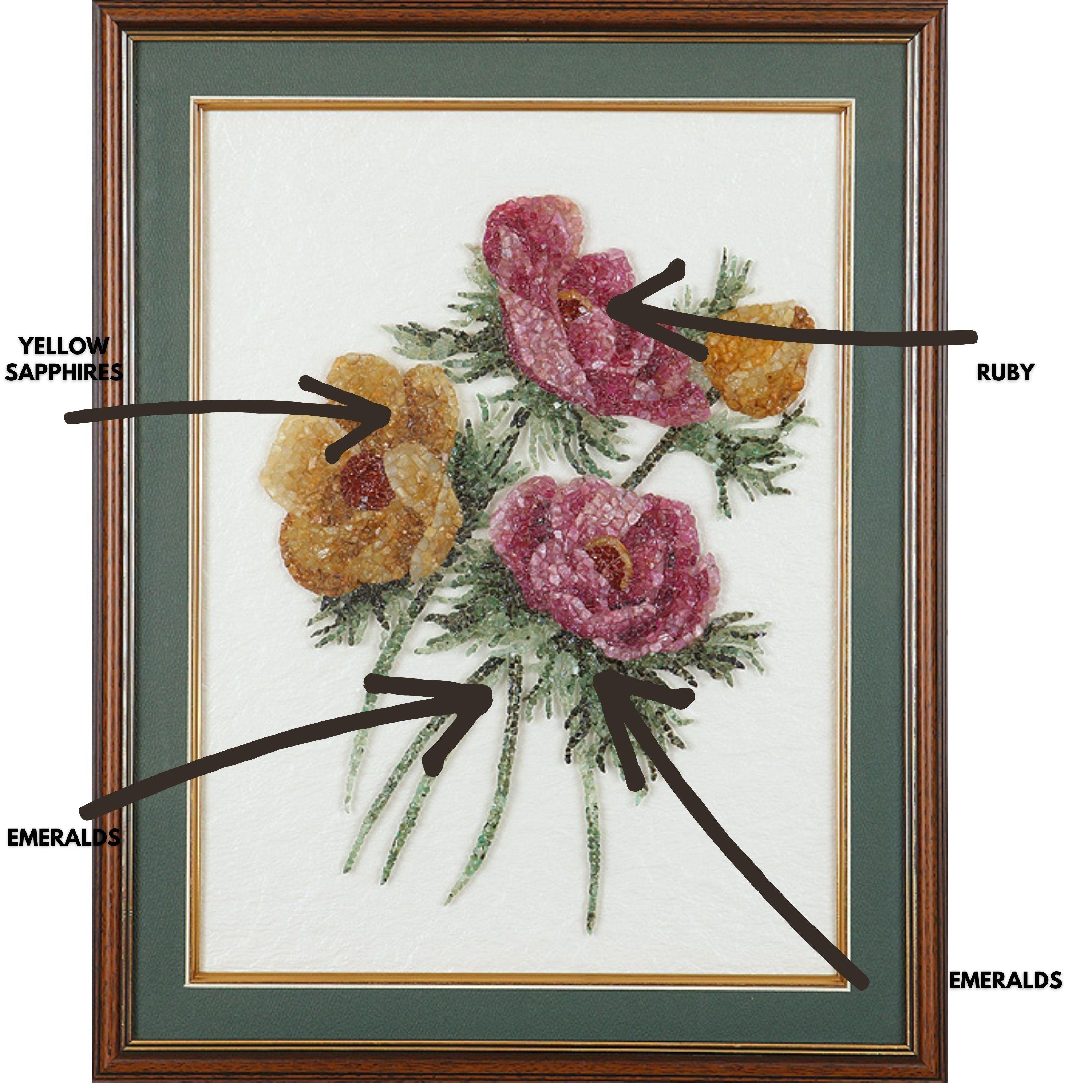 A very gorgeous Floral artwork made using Ruby, Emerald and Yellow Sapphire. The gemstones used in this artwork is completely natural, without any treatment. The size of the artwork is 20 inches x 16 inches. The frame is of a simple painted green
