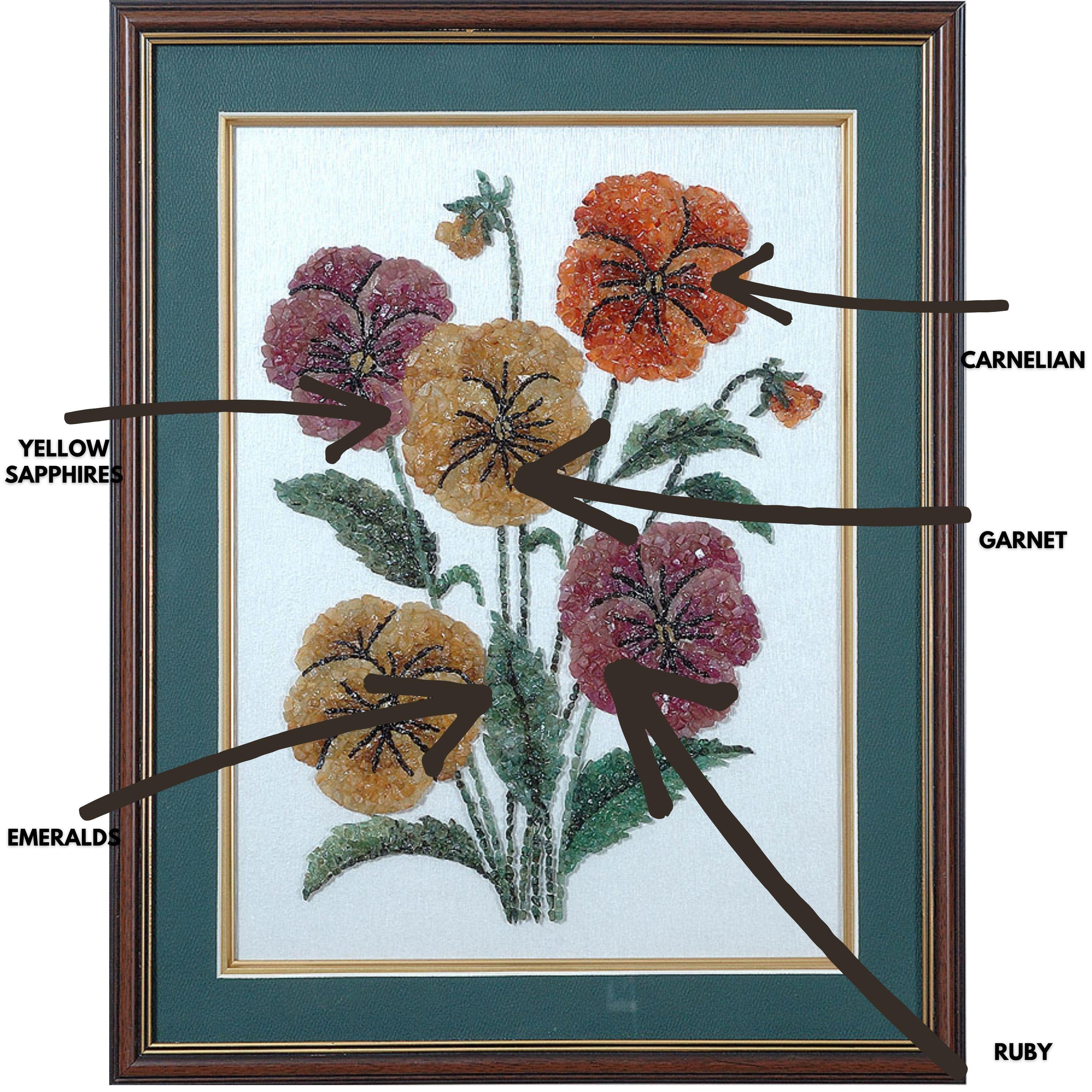 A very gorgeous Floral artwork made using Ruby, Emerald, Yellow Sapphire, Carnelian & Garnett. The gemstones used in this artwork is completely natural, without any treatment. The size of the artwork is 20 inches x 16 inches. The frame is of a