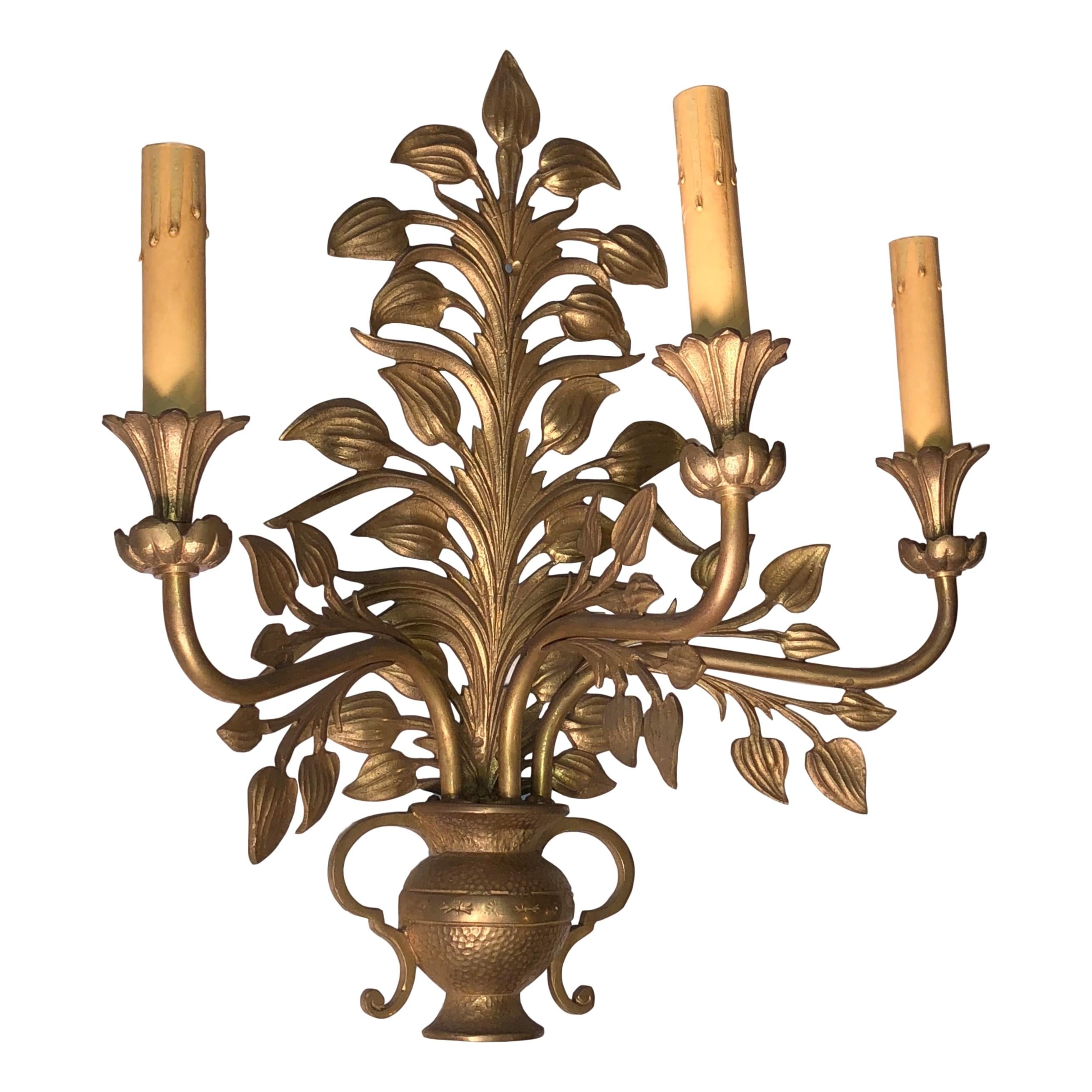 Pair of 1920s French gilt bronze sconces with 3 lights.

Measurements:
Height 17?
Depth 10.5?
Width 16?