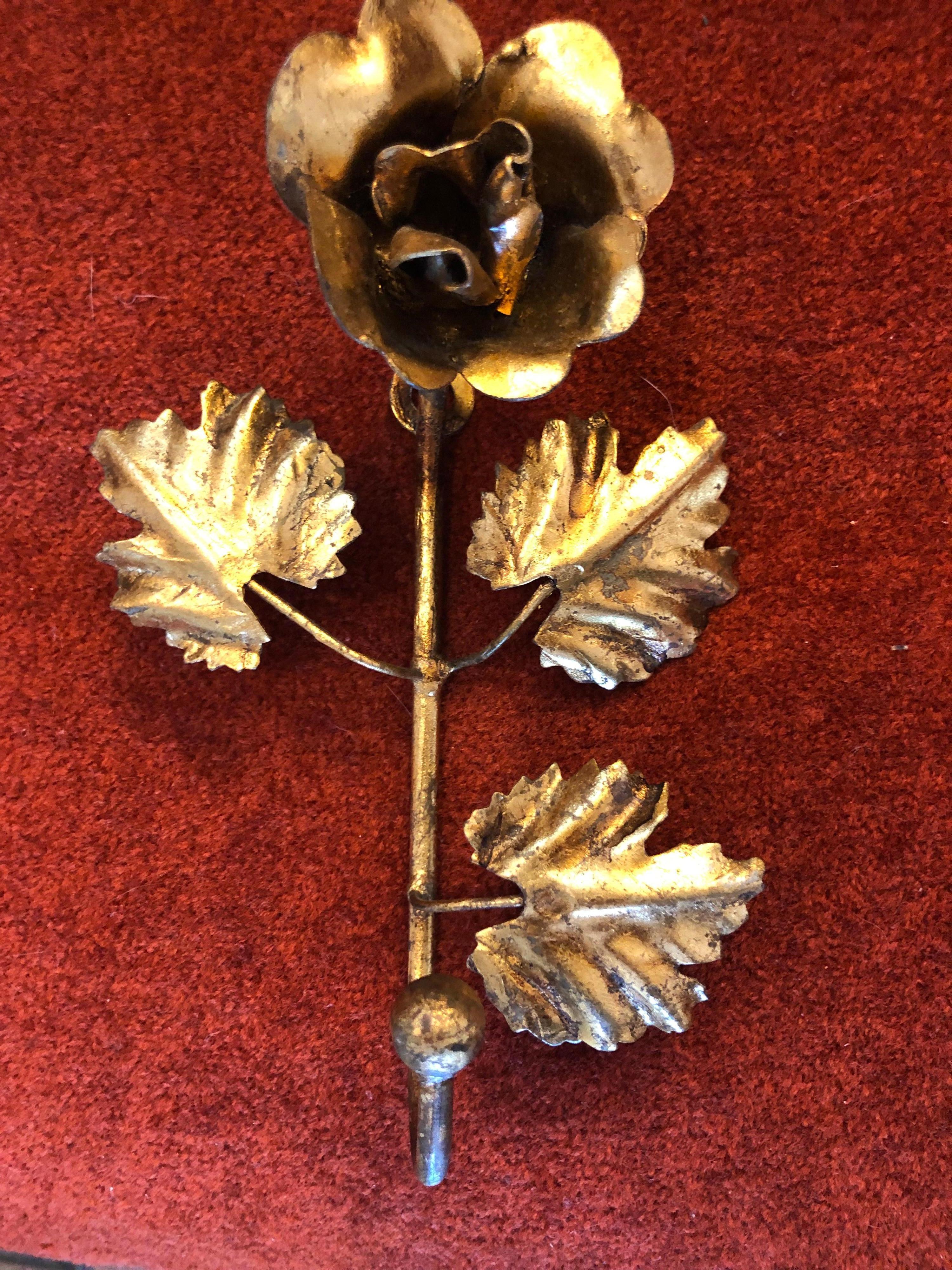 Gilt Iron Hook in the shape of a Rose. Most likely from Florence. Made in Italy . Perfect delicate piece for the back of a closet or bathroom door to hang a robe or nightgown. Dealer shipping would be $25 in the continental US.