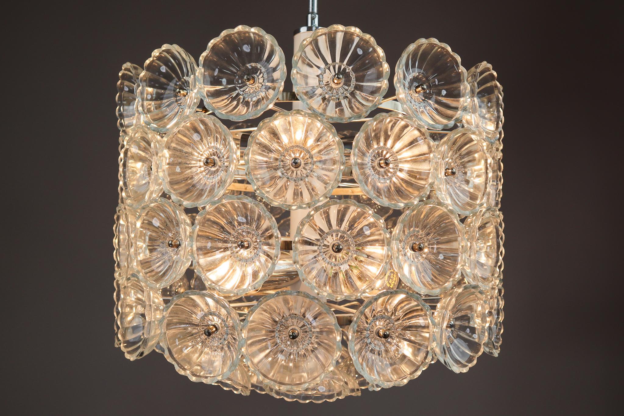 We offer an amazing and rare floral glass and brass light fixture in cylindrical shape in the style of Emil Stejnar, manufactured in the 1960s in Germany. Very heavy with glass flowers on a brass sputnik frame. The glass pieces are beautifully cut