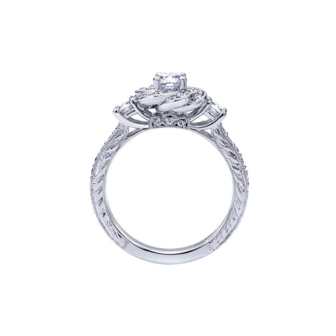 Ladies' 14k Diamond Engagement Ring﻿. Elegant floral halo with milgrain finish, beautiful pave diamonds on the sides and diamond etching give this one of a kind ring a romantic vintage appeal. Center diamond included, 0.33 ct, H color, VS2 clarity.