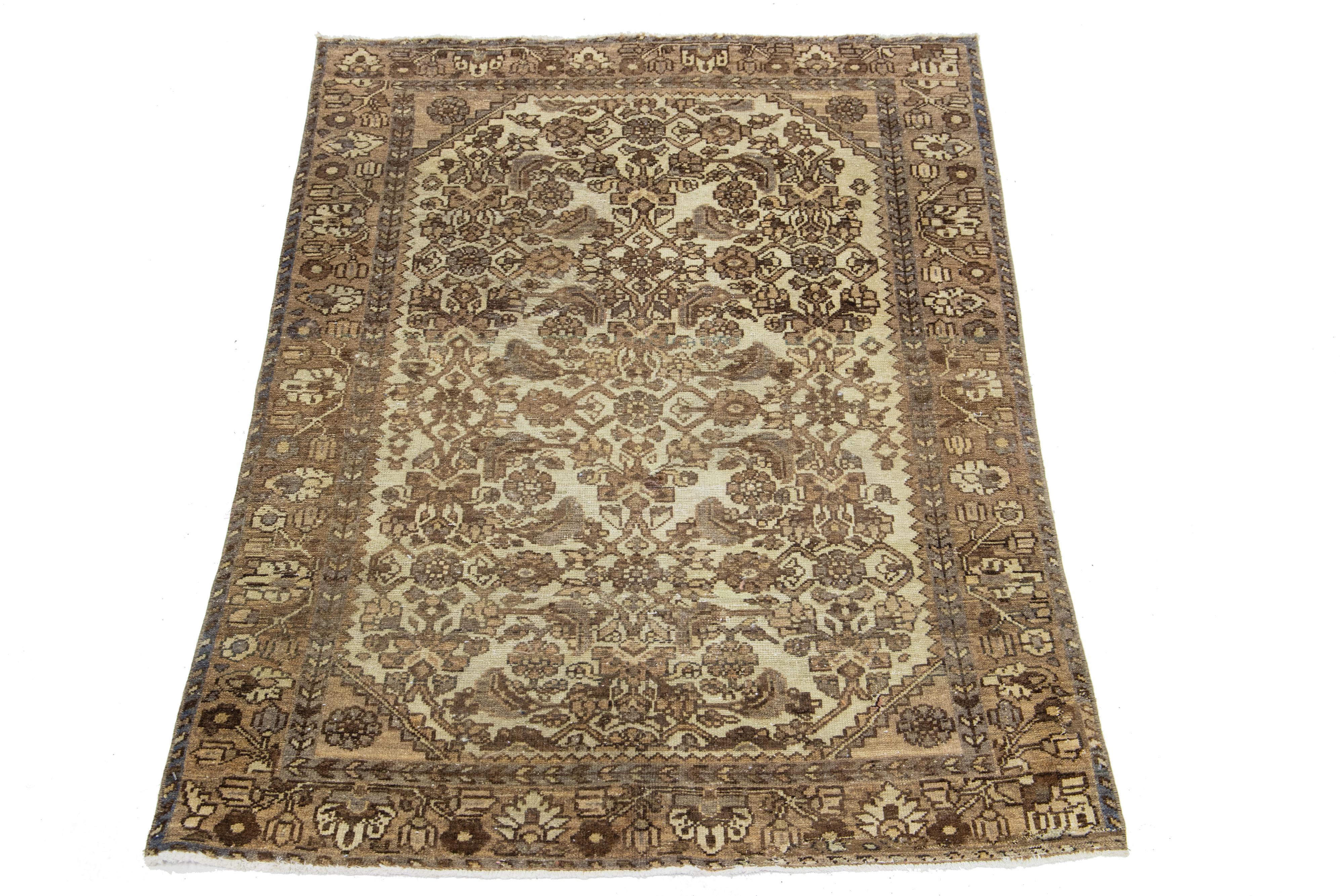 This stunning antique Persian Malayer rug is fashioned from meticulously hand-knotted wool, featuring a serene beige field adorned with brown and gray accents in an exquisite all-over classic design.

This rug measures 3'4
