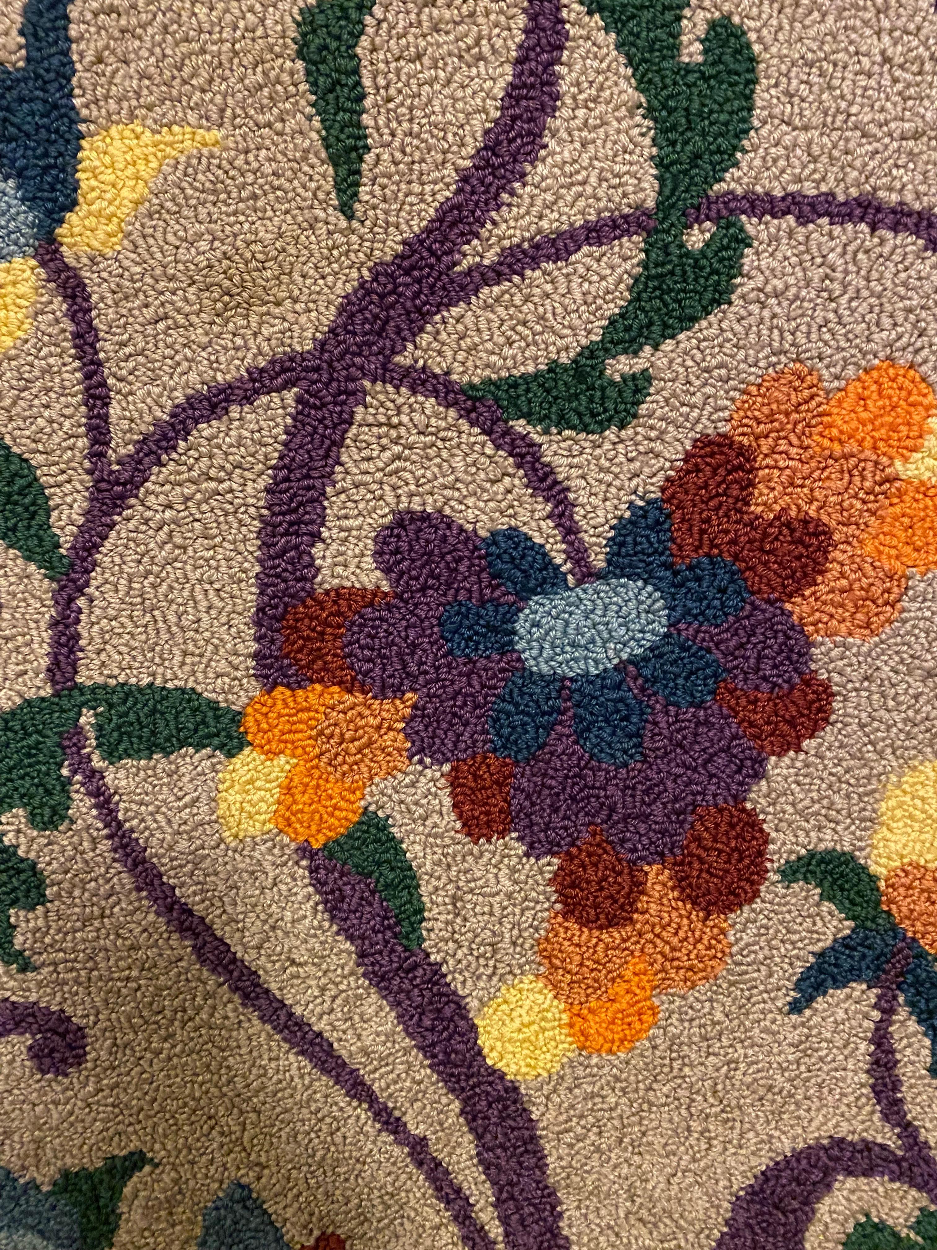 Nice Hook Rug in Shades of Purple and Oranges. In very nice shape! Always hanging on a wall! Is currently set up to hang. Mounted on a wood Cleat.