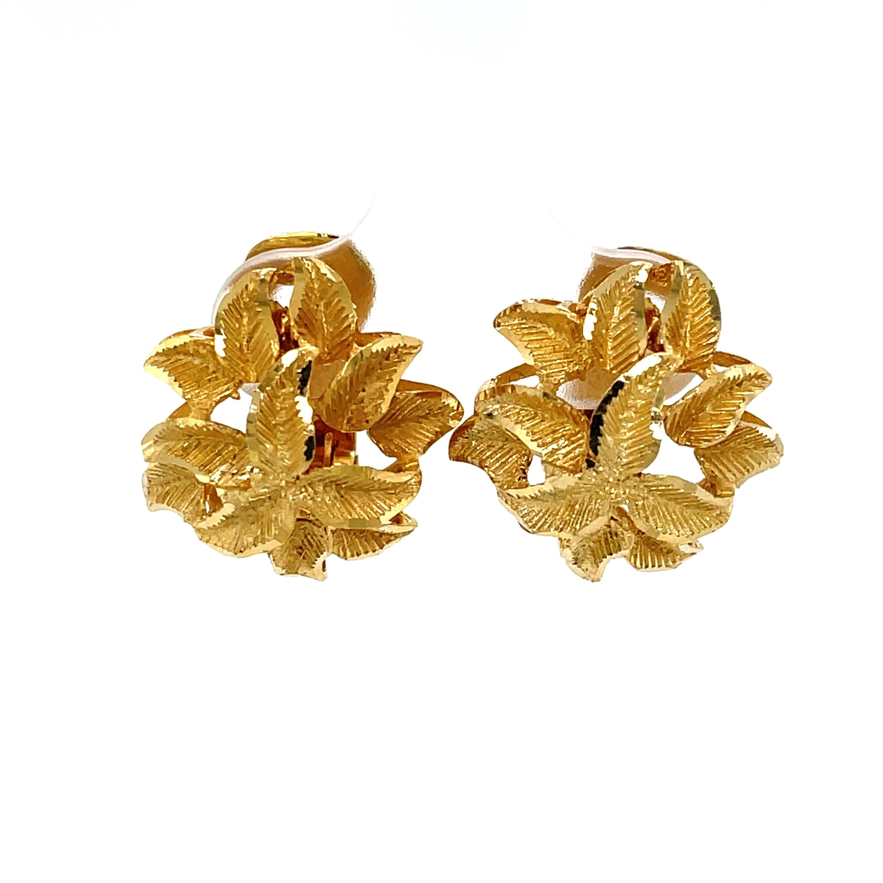 Just right to brighten your look for career or special occasion, this modest 14 karat yellow gold earing pair presents beautifully. A demur floral inspired design is brought to life by its frosted gold finish and gives these 16.5mm round earrings