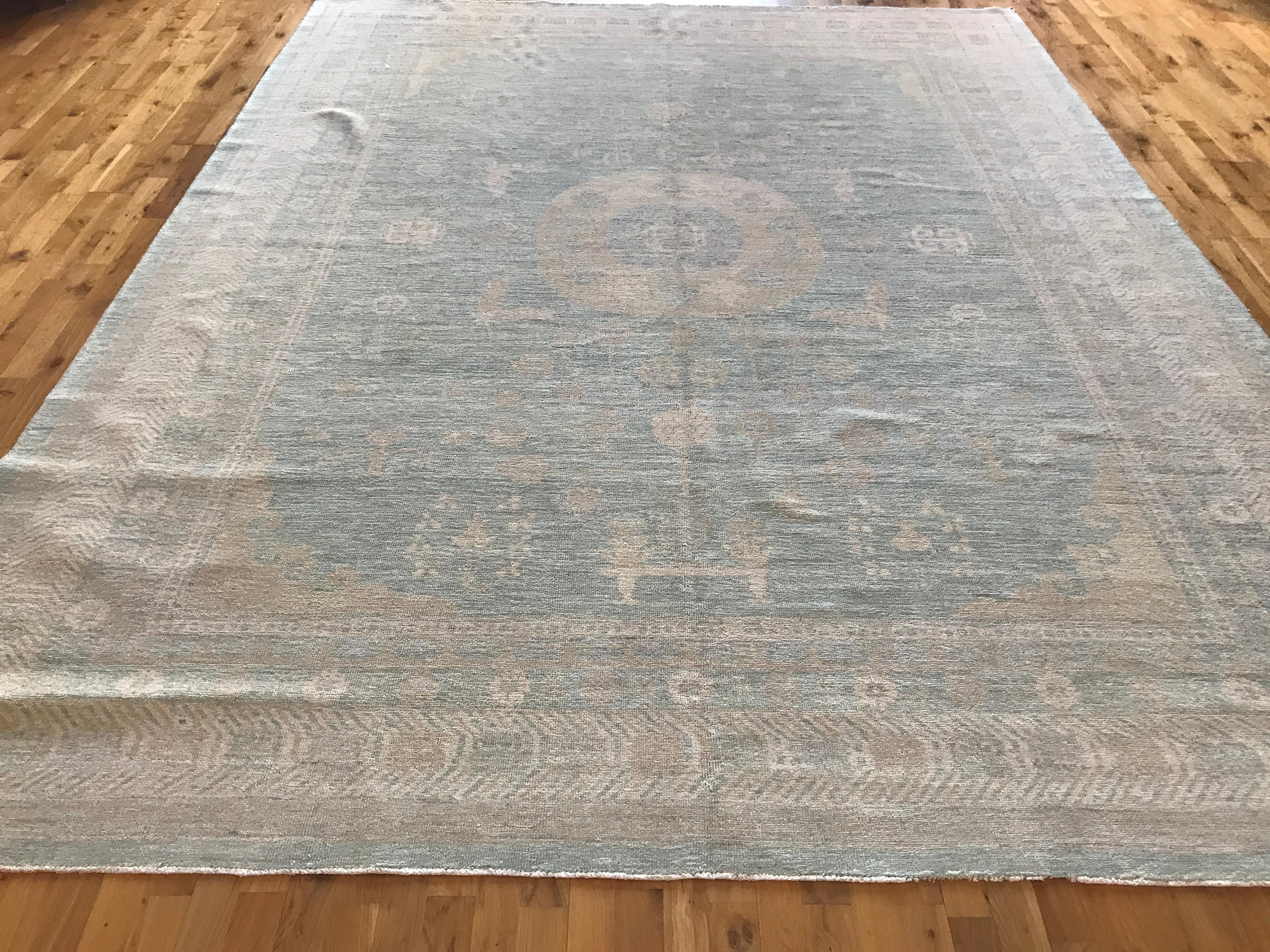 Khotan rugs embody the history and mystery of the Silk Road. This Fine Pakistani Khotan style rug made with vegetal dye is no exception. Today's Khotan's have the added benefit of versatility -- their colors and designs make them equally at home in