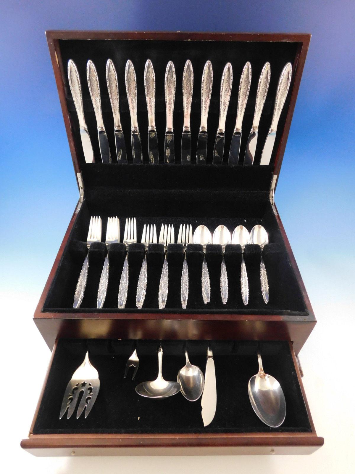 Floral Lace by Lunt sterling silver flatware set - 54 pieces. This pattern has a wonderful modern shape with fine lace-like detailing. This set includes:

12 knives, 9