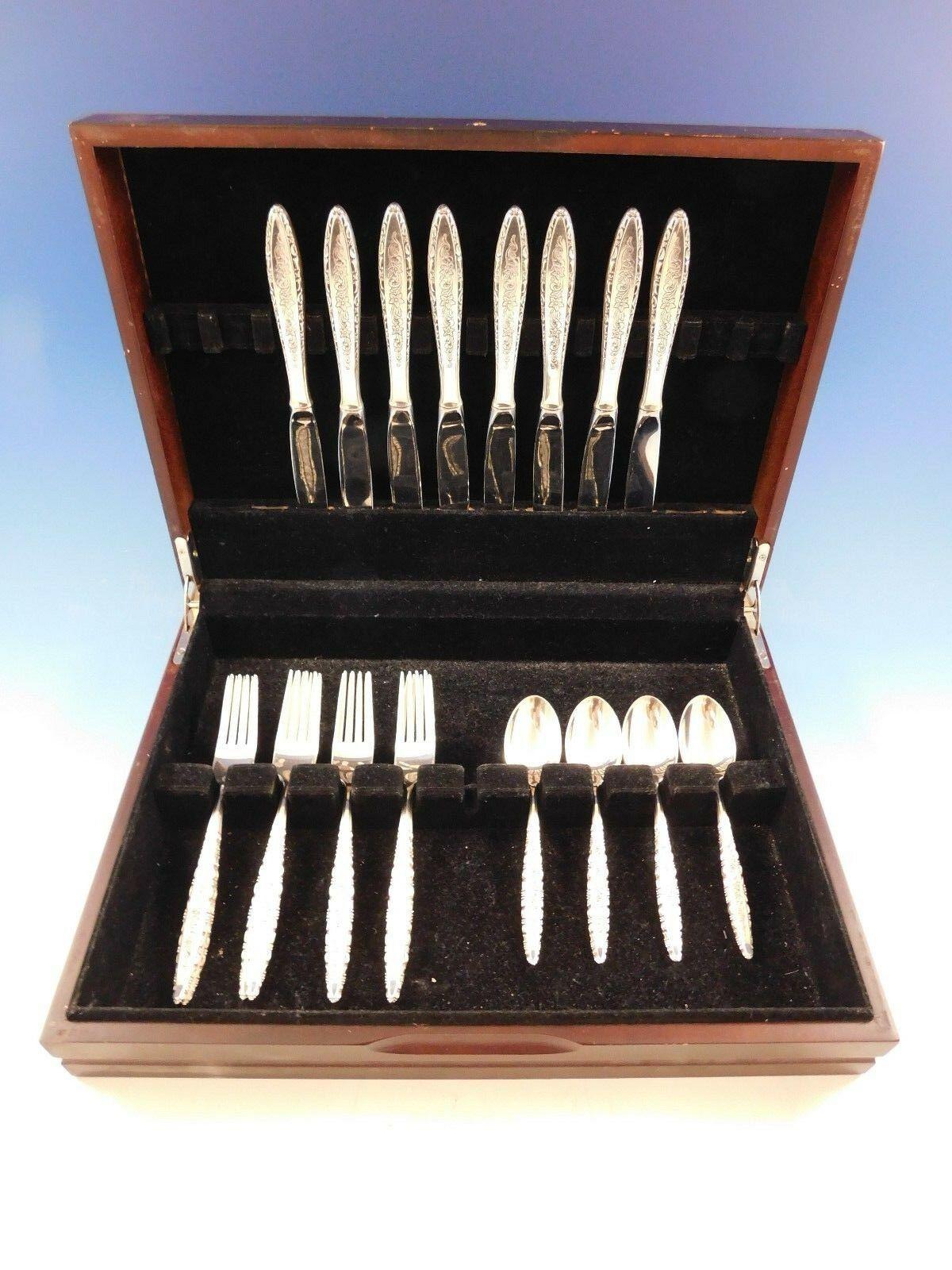 Lovely floral lace by Lunt sterling silver Flatware set, 24 pieces. This set includes:

8 knives, 9