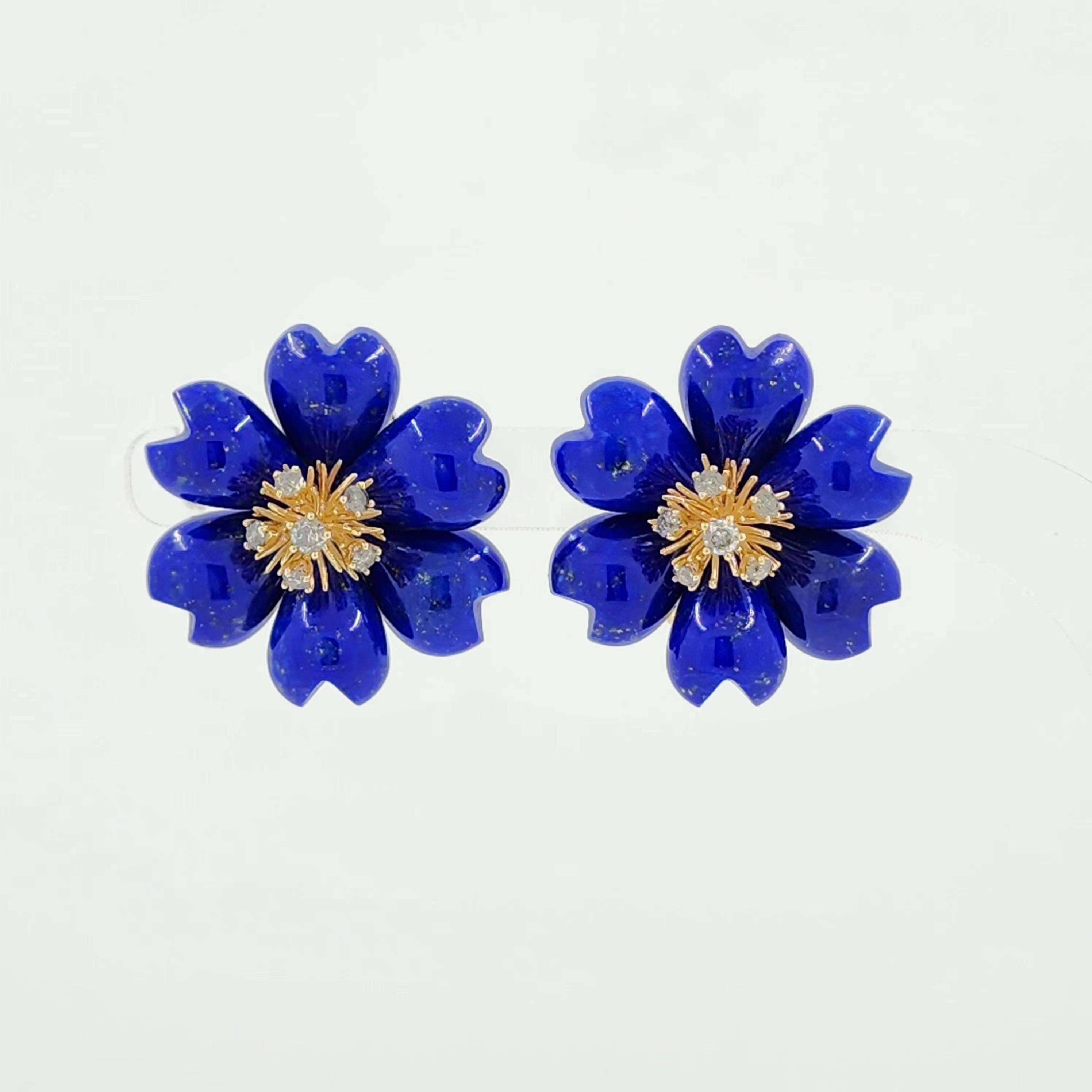 These exquisite earrings showcase a stunning floral design crafted from deep blue Lapis Lazuli, weighing a total of 46.51 carats. The petals of the flower are intricately carved, highlighting the natural beauty and unique hue of the Lapis Lazuli. At