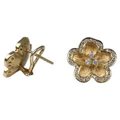 Floral luxurious diamond earrings in 18KT yellow gold diamond earrings omega