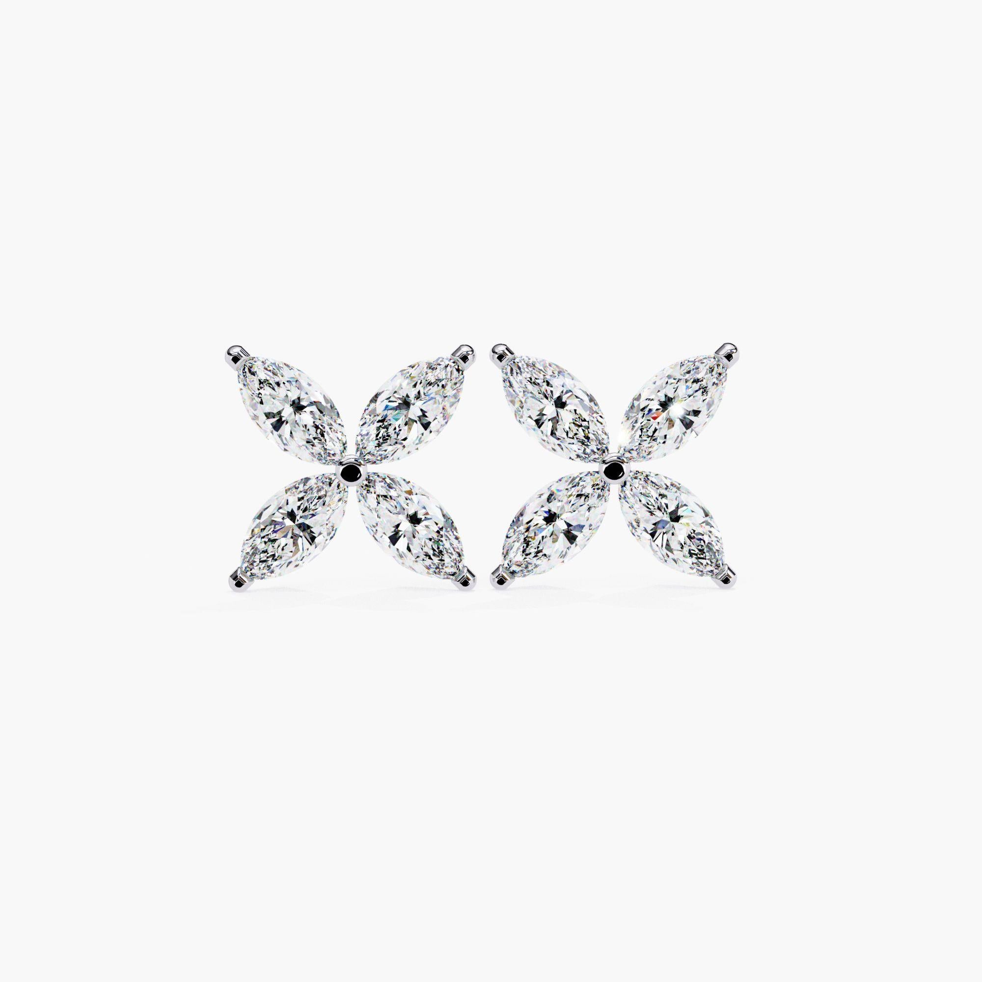 The Marquise Diamond Petal Stud Earrings are a delicate and timeless accessory, crafted from 14k gold. Each earring features a dainty four-petal flower design, with sparkling marquise-cut diamonds as the petals. These minimalist floral earrings make