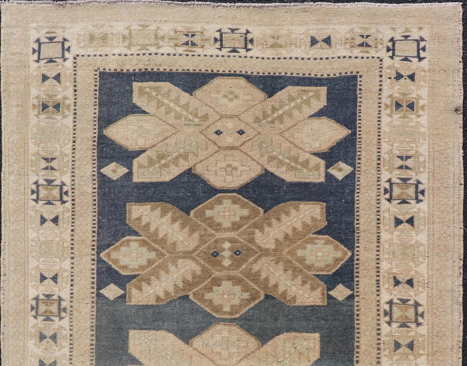 Hand-Knotted Floral Medallion Vintage Hand Knotted Turkish Oushak Rug with Geometric Border For Sale