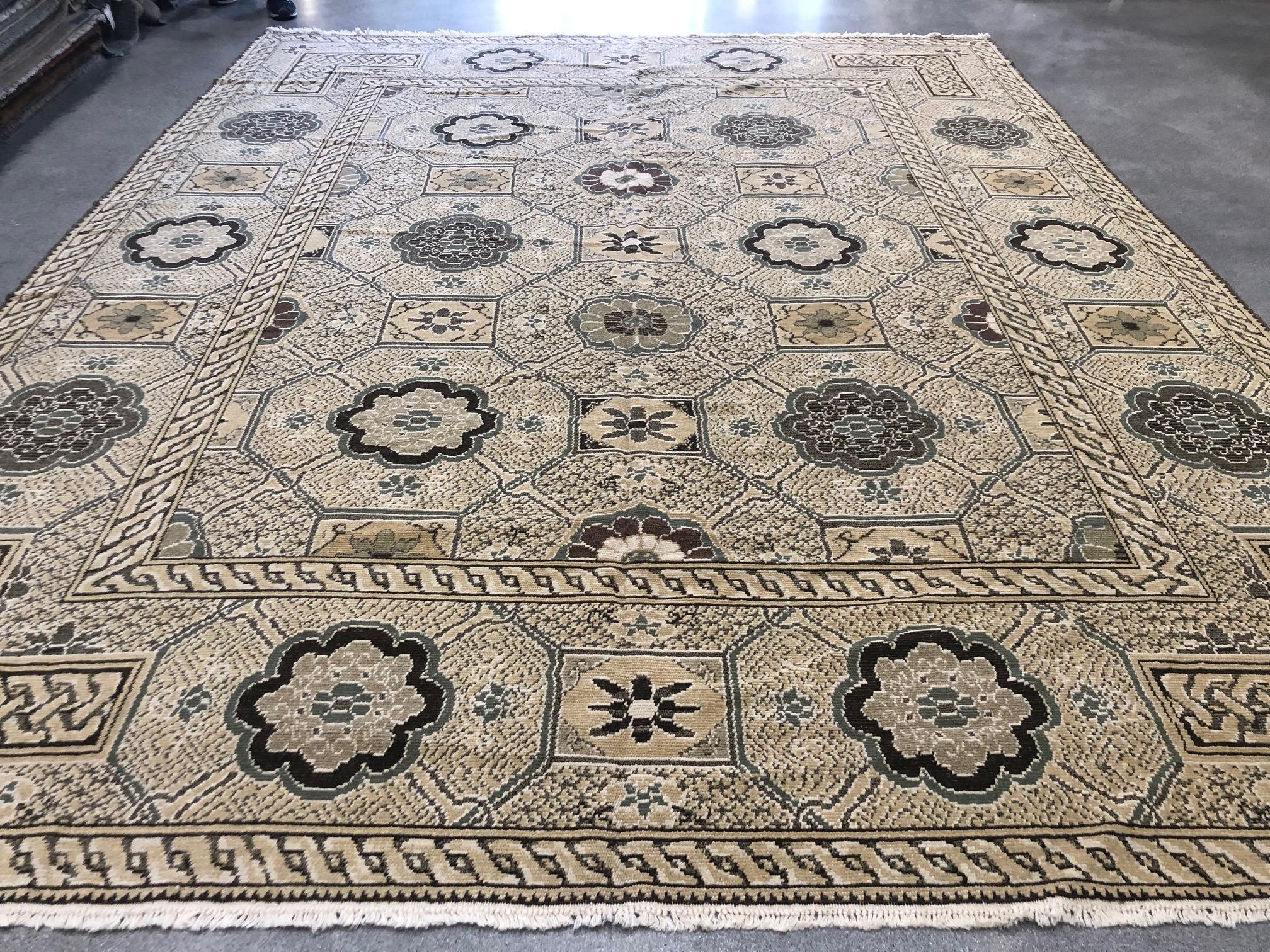 This eclectic rug features a rug-within-a-rug look using braided frames, floral medallions and geometric shapes against a beige background. Brown, taupe, grey and yellow tones add to the distinctive look and feel of a rug that is sure to garner its