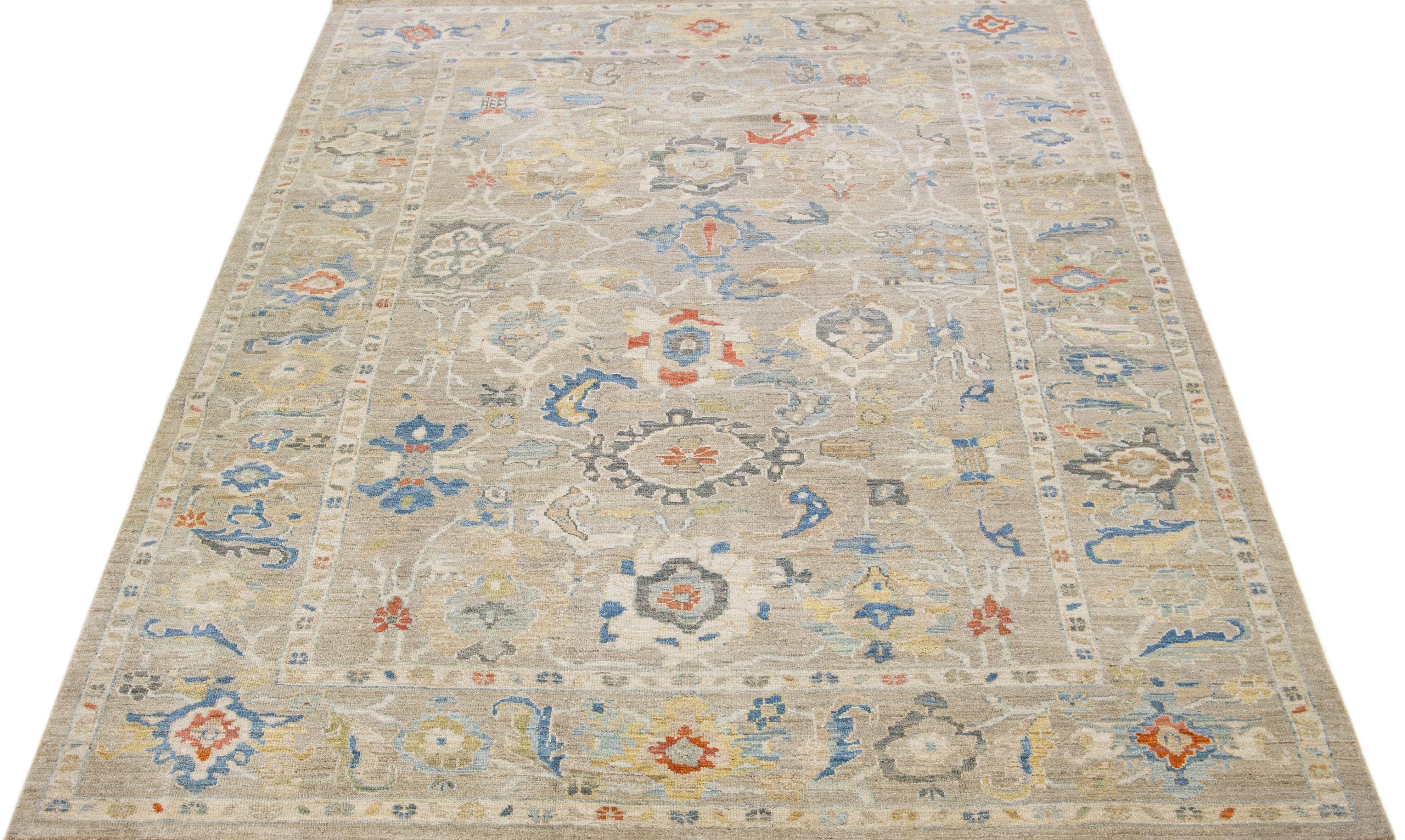 Beautiful modern Sultanabad hand-knotted wool rug with a beige color field. This rug has a designed frame with multicolor accents in a gorgeous all-over floral design.

This rug measures: 8'8
