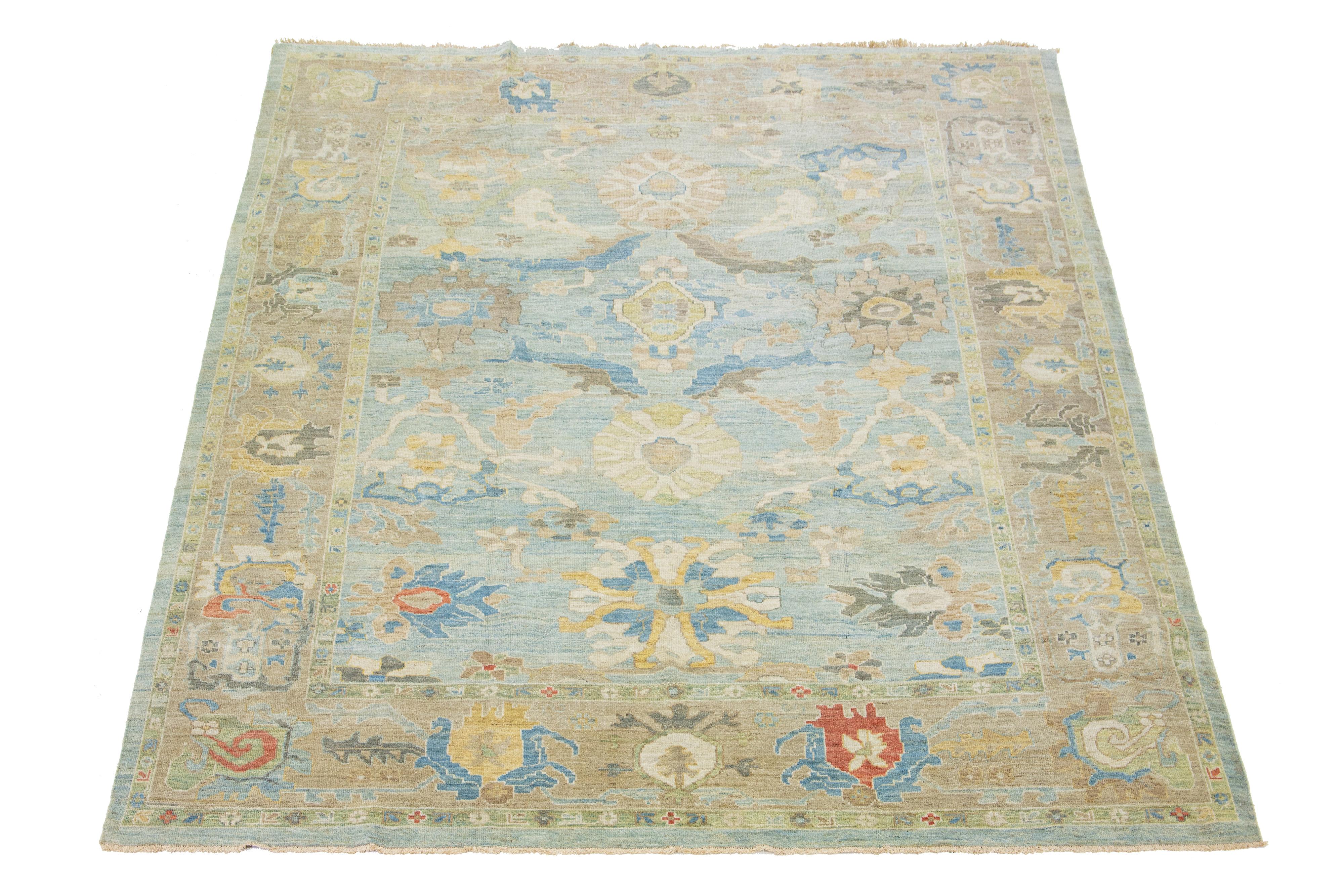 Beautiful modern Sultanabad hand-knotted wool rug with a blue field. This Sultanabad rug has beige and brown accents in a gorgeous all-over classic floral pattern design.

This rug measures 10'3