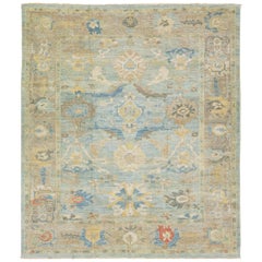 Tapis moderne Sultanabad en laine bleue à motifs floraux