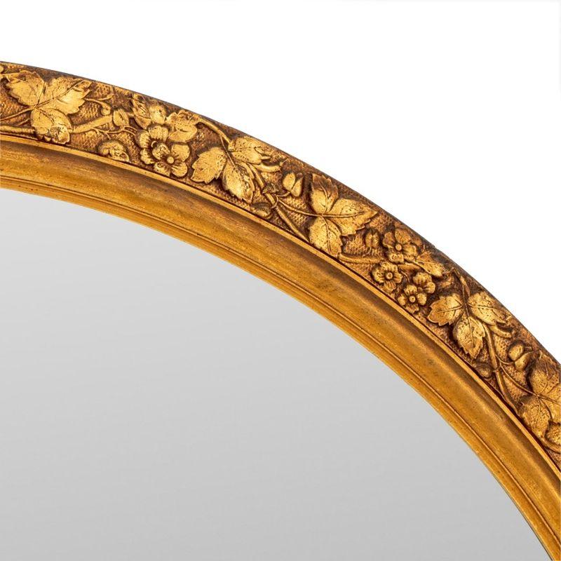 Miroir mural circulaire en bois doré sculpté de motifs floraux. Plaque de miroir : 35,25