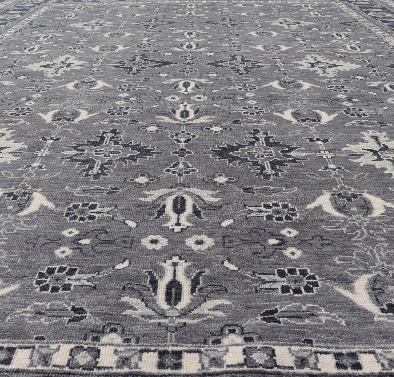 Floral Motif Khotan Area Rug by Keivan Woven Arts in Wool
Measures 9'0 x 12'0 
Country of Origin: India;  Type: Khotan;  Design: Floral, All-Over, Geometric Floral;  Keivan Woven Arts; rug IN-TVN-1457; Floral Motif Charcoal and Gray Muted Indian