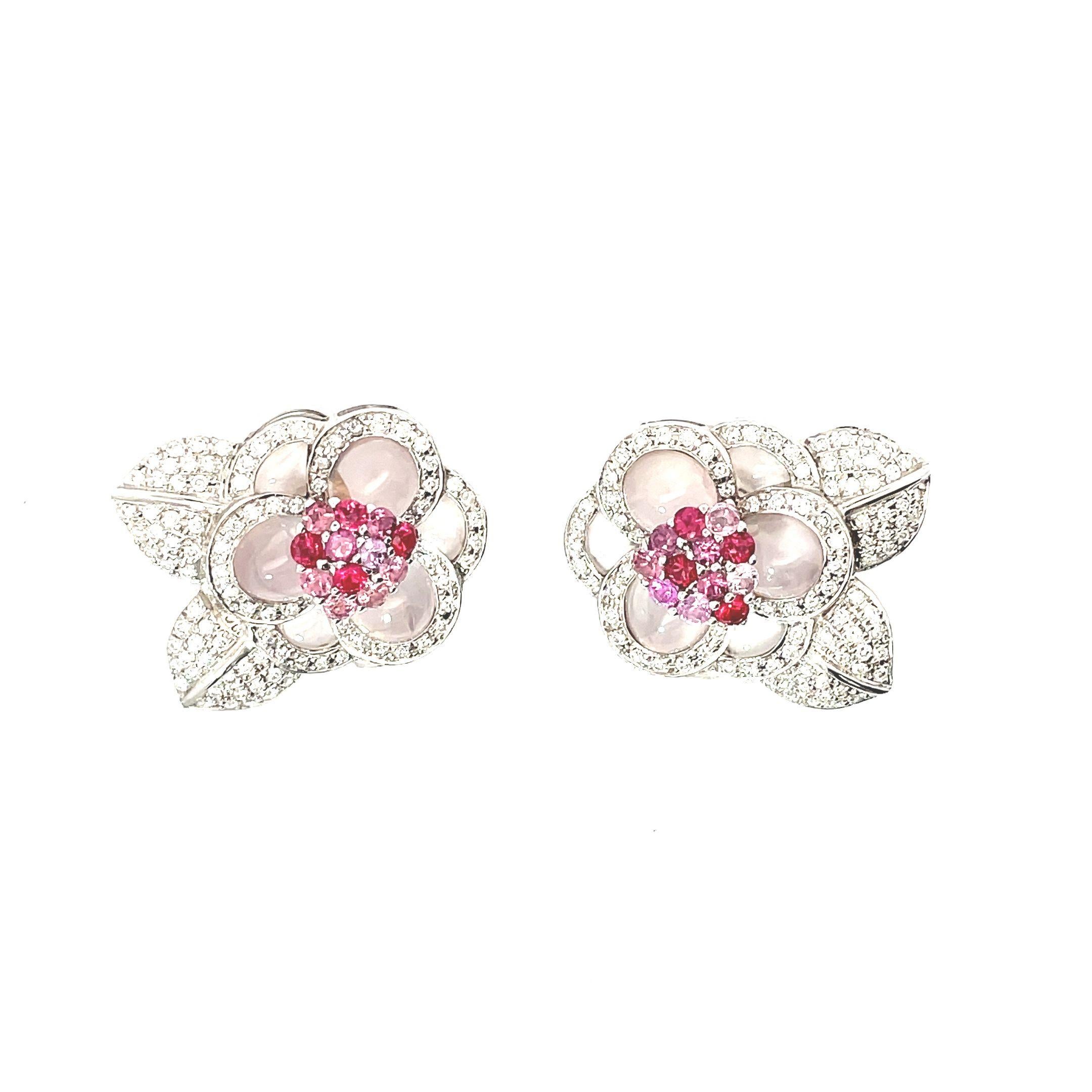 These exquisite floral clip-on earrings would make a beautiful addition to any jewelry collection. Crafted from lustrous 18K white gold, delicate rose quartz petals are arranged in a symmetrical bloom motif surrounded by twinkling diamonds that