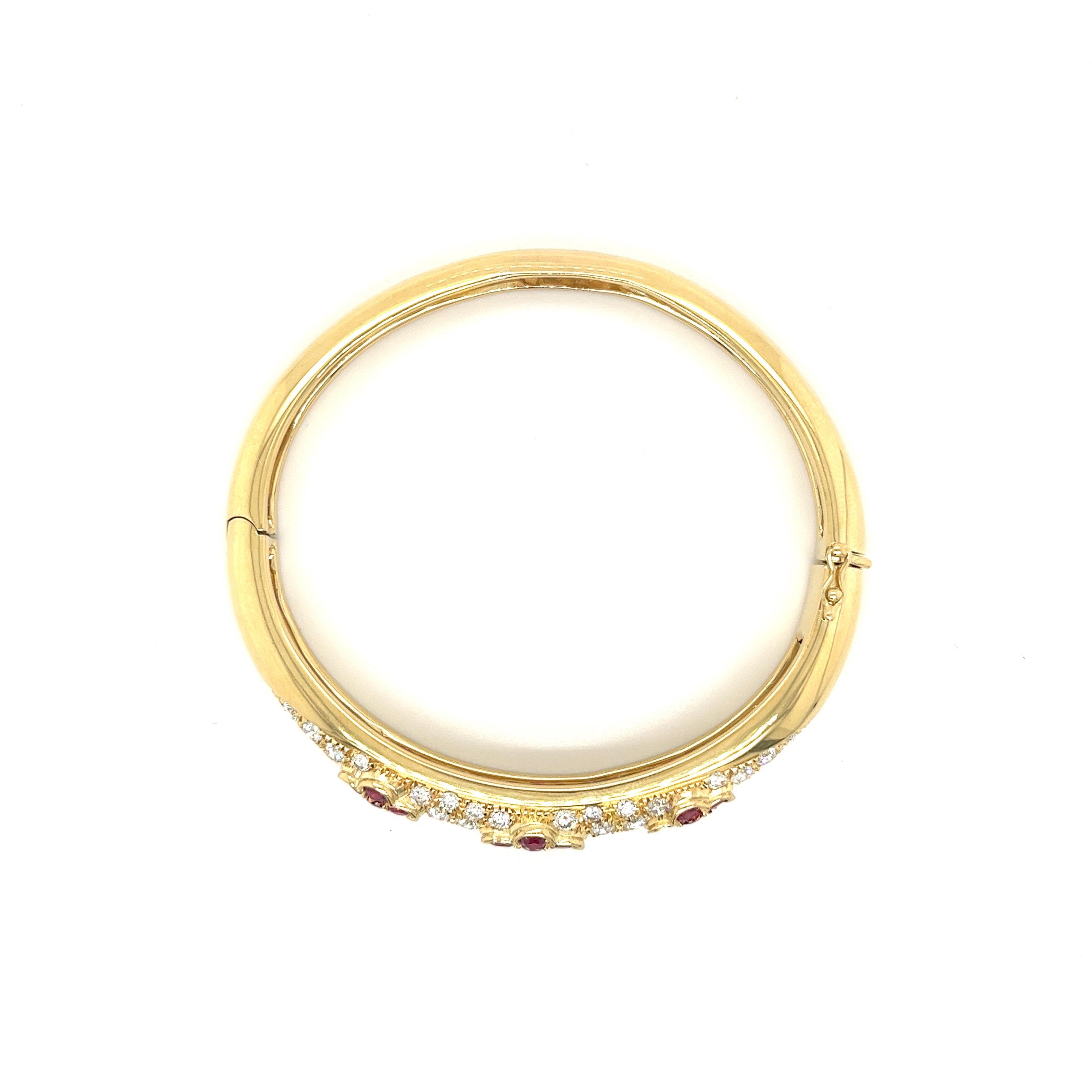 Floral motif Ruby and Diamond cluster bangle in 18 karat yellow gold. This bangle bears the aesthetic and structural integrity to be worn daily and for special occasions. Hypoallergenic and waterproof so you never have to take it off.

This bracelet