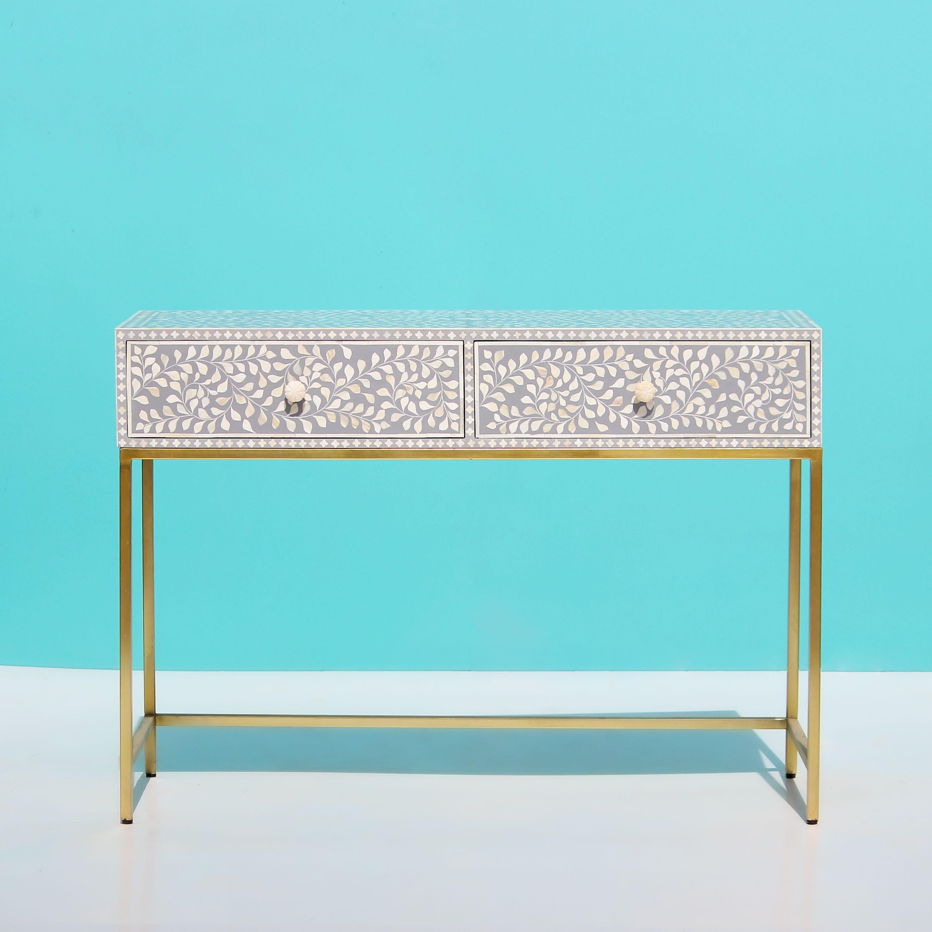 Elevate your home with our stunning bone inlay console table, a timeless masterpiece that seamlessly blends old-world charm with modern elegance. Intricately adorned with four leaf flower patterns, this table is a tribute to the ancient art of