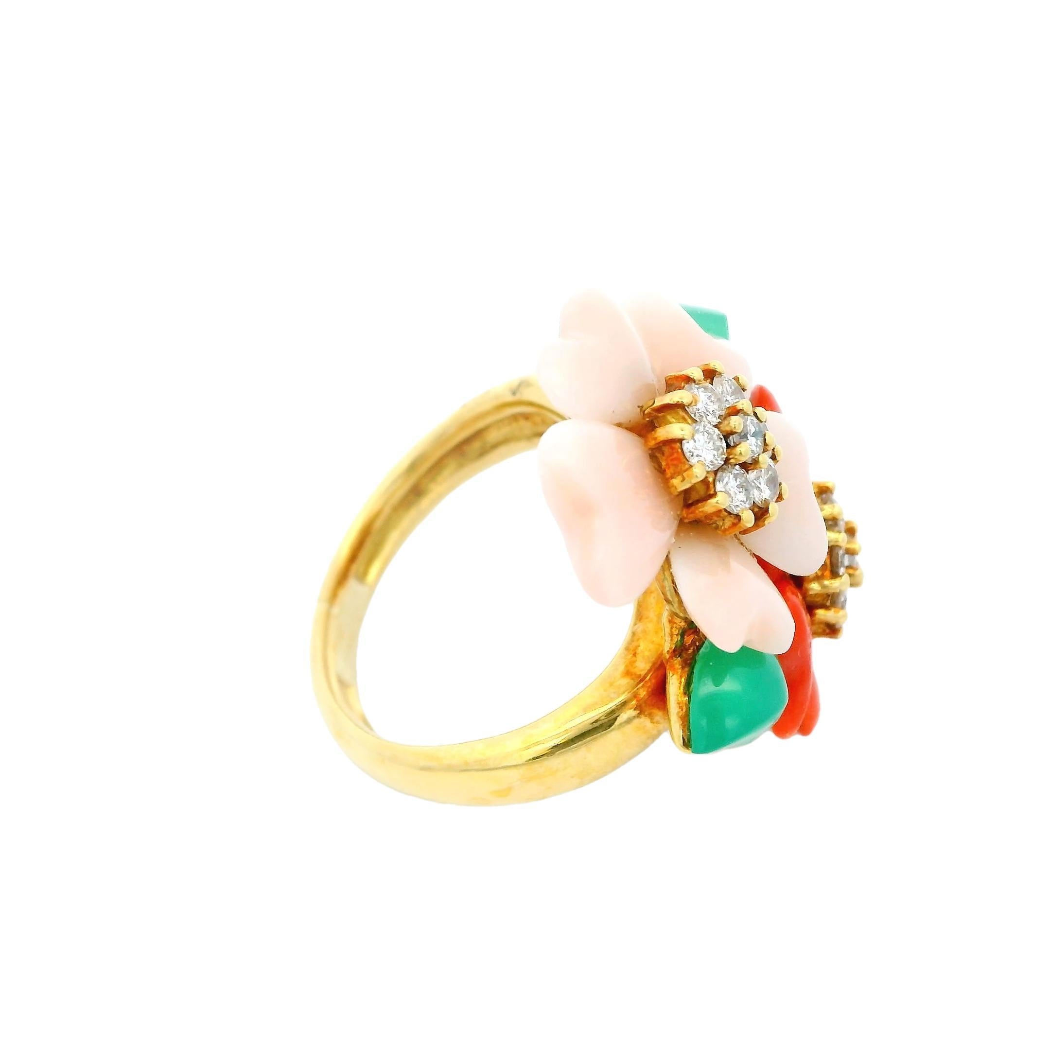 A vibrant and elegant ring featuring floral motifs with round white diamonds totaling 0.48 carats.

The diamonds are set at the center of two flowers, one in soft pink and the other in bold red, accented by green leaves.

Crafted in 18k yellow gold,