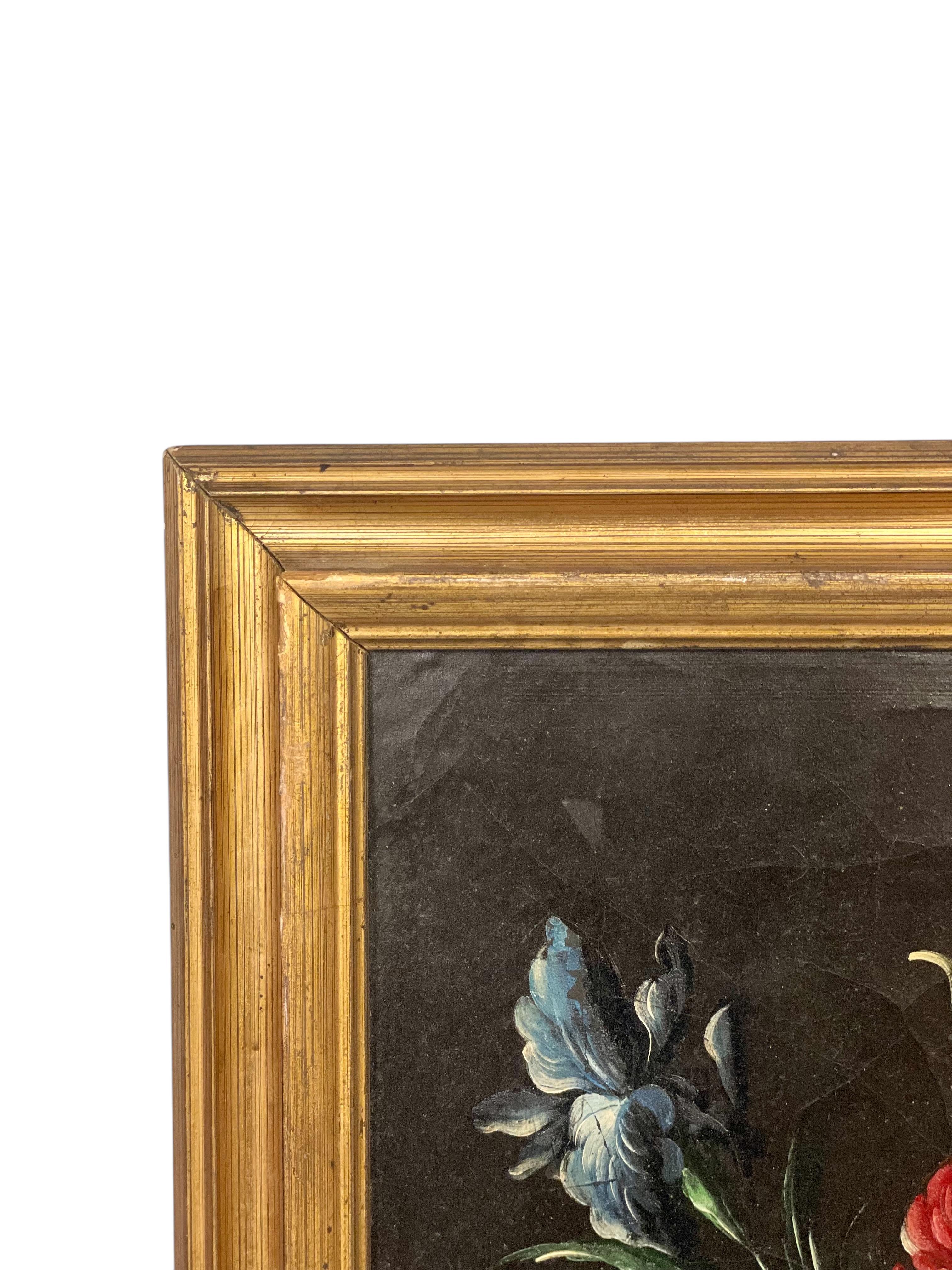 This charming antique oil on canvas captures the timeless elegance of a floral still life, masterfully rendered by the hand of French artist B. Girodelle, whose signature appears in the lower right corner. Set against a dark, moody background that