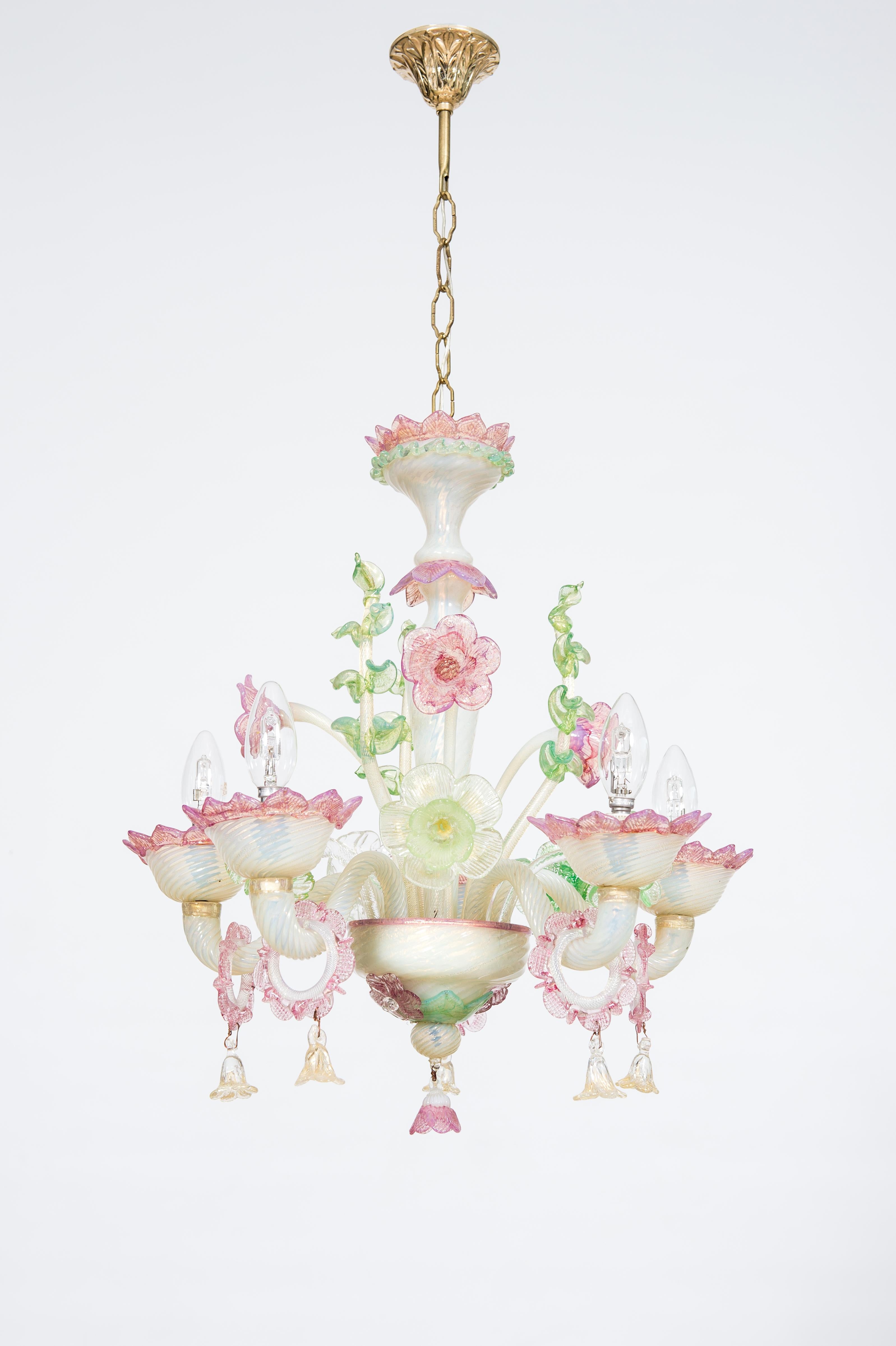 Floral Opaline Murano Glass Chandelier with Gold Handcrafted in Italy 1900s.
This fine opaline chandelier, handcrafted in Murano Island (Venice area Italy) in the 1900s, stands out for its colorful floral decorations embellished with a layer of